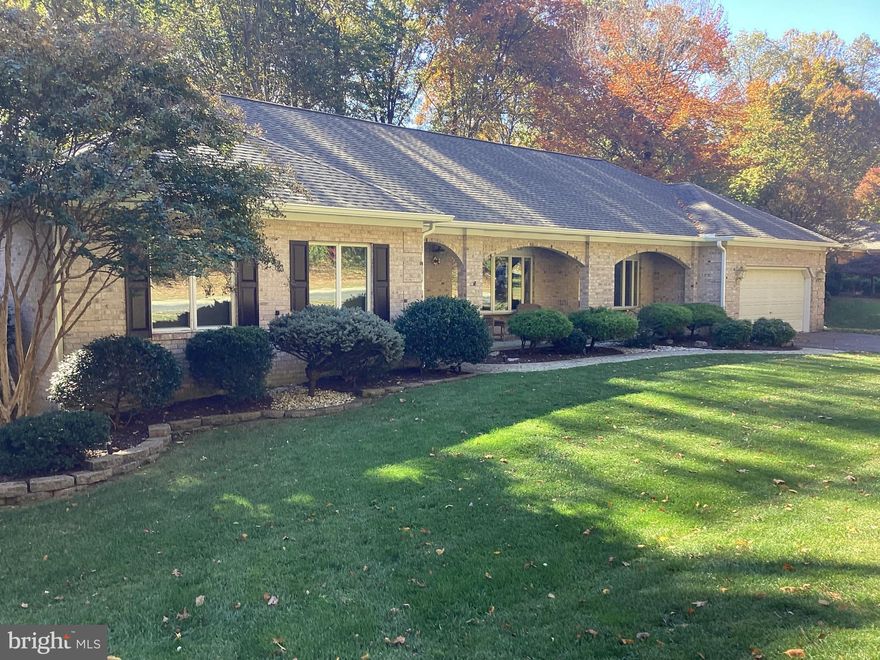 Welcome home! This stunning ranch-style residence offers a perfect blend of comfort and elegance, nestled on a premium lot backing to wooded area. This home is designed for both relaxation and entertaining. Step inside to discover a warm and inviting interior. The open floor plan seamlessly connects to the family room, complete with a cozy fireplace with gas insert.  Eat-in kitchen features modern appliances including a wall oven, built-in microwave, and generous pantry space. A beautiful sunroom is adjacent to the kitchen and family room which features vaulted ceilings, recessed lighting, ceiling fan, zoned heat/ac, and looks out to a beautiful nature view. The primary suite, includes a walk-in closet and large primary bathroom with walk-in shower. Enjoy the convenience of a main floor laundry room. Outside, relax on your private deck, ideal for morning coffee or evening cocktails. The attached 2 car garage and driveway offer ample parking and easy access. Security features include monitored alarm system (available) and exterior lighting.  This home features a new architectural shingle roof (9/2024), new oversized gutters and spouts with new premium gutter guard. New carpeting in all bedrooms and hallway, and new interior paint throughout (2/2025). Energy efficient windows. Basement features abundant area for future living space and a rough in for another full bath. A natural gas whole house generator means you will never be left with the lights out! Don’t miss the opportunity to make this exceptional property your own, where every detail has been thoughtfully designed for your comfort and enjoyment!