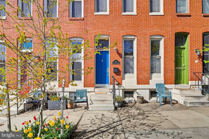 Welcome to 122 W Clement Street—a stunning 3-bedroom, 3.5-bath brick townhome offering four levels of thoughtfully designed living space.

The main level welcomes you with a bright and open living room, where a neutral color palette creates a fresh, modern feel, complemented by a charming exposed brick accent wall that adds warmth and character. The space flows seamlessly into the dining area, ideally positioned between the living room and kitchen—perfect for entertaining and everyday gatherings.

The kitchen continues the open-concept design, featuring a convenient breakfast bar, ample workspace, and easy flow for multitasking. Just beyond the kitchen, you’ll find a pantry closet, a spacious half bath, and access to the rear parking pad, adding both comfort and convenience.

The first upper level features two generously sized bedrooms, each with its own private full bathroom and ample closet space—ideal for both privacy and functionality. A centrally located laundry area in the hallway provides added ease for daily living.

Ascending to the top level, you’ll discover the rooftop retreat! A TREX deck, low maintenance, and installed just a year ago—an exceptional outdoor escape offering panoramic city views. Whether hosting guests or enjoying a quiet evening, this space is perfect for relaxing and entertaining.

The lower level expands your living options with a comfortable space ideal for a bedroom, guest room, home office, or additional living space, complete with a large closet and a full bathroom featuring a walk-in shower. A large utility room completes this level, providing excellent storage and easy access to home systems.

The home combines all the must-have features of a South Baltimore layout: side-located stairs to the second floor and rooftop, tall windows with beautiful plantation shutters, a front-to-back usable lower level, and first floor bathroom make this home feel spacious and livable.

Ideally located on a quiet street, with all the comforts of hassle-free living, yet close to the many attractions and points of interest the South Baltimore area has to offer. Enjoy nearby Cross Street Market and Locust Point with quick access to shopping, dining, and essentials, Riverside Park for green space and recreation, and nearby stadiums for entertainment. Commuters will appreciate the proximity to I-95, I-295, and the Baltimore-Washington Parkway, making travel to downtown, BWI Airport, and beyond a breeze.

Don't miss out on the chance to make this charming townhome yours!