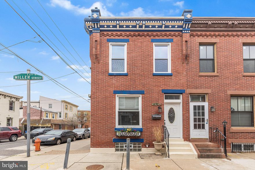 Welcome to 636 Miller St, a unique home nestled on a prime corner in Fishtown. As you approach, the ornate cornice immediately captures your attention, while the view down Miller Street reveals a lush green space at the block's end. Step inside to discover a living space bathed in natural light, thanks to expansive windows offering triple exposures. Original hardwood floors guide you to the dining room and a fully updated kitchen at the rear. Renovated in 2017, the kitchen boasts quartz countertops, subway tile, stainless steel appliances, and ample storage. A stylish half bath is conveniently located on this main level. Upstairs, you'll find three spacious, light-filled bedrooms and a beautifully updated primary bath. Enjoy peaceful mornings or evenings on the second-floor patio, accessible from the rear bedroom. The basement features a finished area perfect for a home office, gym, or media room. It also includes a laundry room equipped with commercial-grade Speed Queen appliances and a generous storage area. Additional upgrades include updated windows, central air, and a security system with cameras. Located steps away from Fishtown's vibrant scene, you can easily walk to Reanimator, Loco Pez, Cedar Point, Kraftwerk, Lloyd, and numerous other top-tier restaurants and shops along Frankford Ave. Plus, with the El nearby, Old City or Center City is less than a ten-minute ride away. Its proximity to Alexander Adaire Elementary School makes this home an ideal choice for a young family. Do not miss your chance to become the next stewards of this classic Fishtown home.