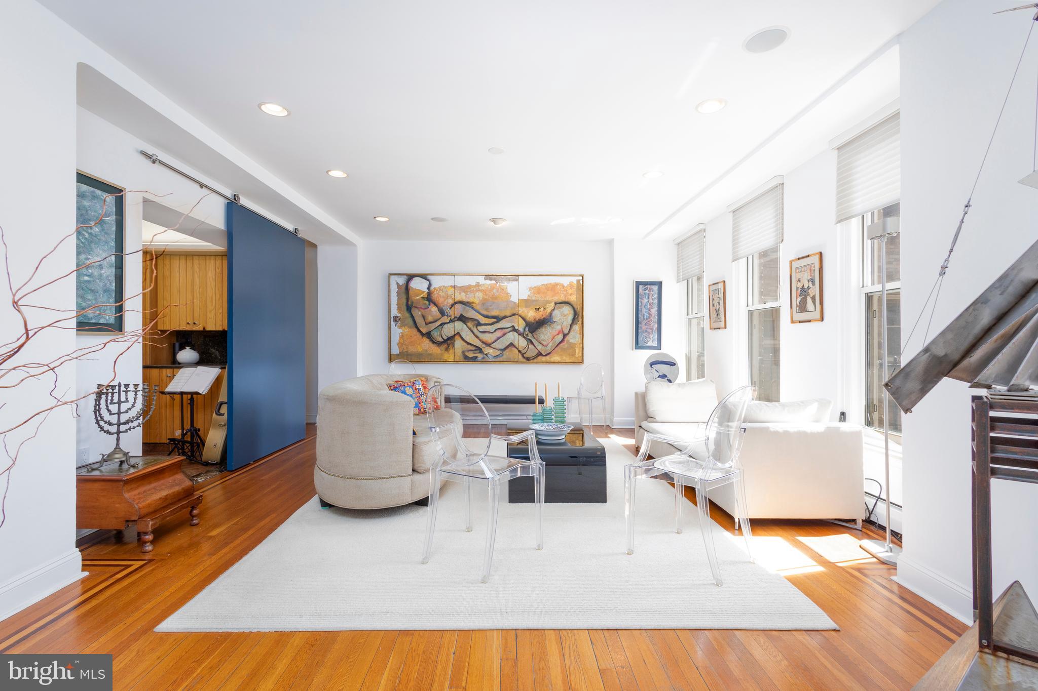 Simply fabulous two bedroom, 2 1/2 bath apartment overlooking the treetops of Rittenhouse Square. Sophisticated decor, beautiful finishes, and impeccably maintained, this apartment is one of the best in this incomparable pre-war building. Enter through a spacious foyer with ample coat closet to a large , light-filled living room, with three south facing windows on the Square, a gas fireplace, a sliding wall to close off (or open up) the kitchen as you like. Relax in the cozy den with bookcases (once used as a dining room). The eat-in kitchen offers gas cooking, lots of cabinetry, and granite counters. A wall of bookcases and cabinetry complete the office with its built-in wrap around desk. Off the office is the stackable laundry and necessary powder room. The bedroom wing is separated from the main living area by a hallway. Each bedroom has its own bathroom that are in excellent condition. Lots of storage , a thoughtful floorplan, hardwood floors, high ceilings, and an exceptional building staff makes this a great fit for your next chapter.