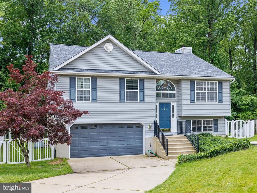 Nestled in a quiet cul-de-sac, this beautifully renovated split foyer home offers a perfect blend of modern updates and comfortable living in the Chesapeake school district. The open-concept main level features soaring cathedral ceilings that fill the space with natural light, creating a bright and airy ambiance in the expanded renovated kitchen.  The spacious primary suite is a true retreat, complete with a large ensuite bathroom with soaking tub for added privacy and luxury. Additionally upstairs offers two other generous size bedrooms and another full bathroom with dual vanity.  Thoughtful renovations throughout the home include newer flooring and brand new carpet ensuring move-in-ready convenience, all within a peaceful and private setting ideal  for entertaining. Lower level offers office space along with a rec-room and wood burning fireplace, oversized laundry room with added storage, half bathroom, and access to the garage. Roof is 2019 and has a one time transferable 40 year warranty.