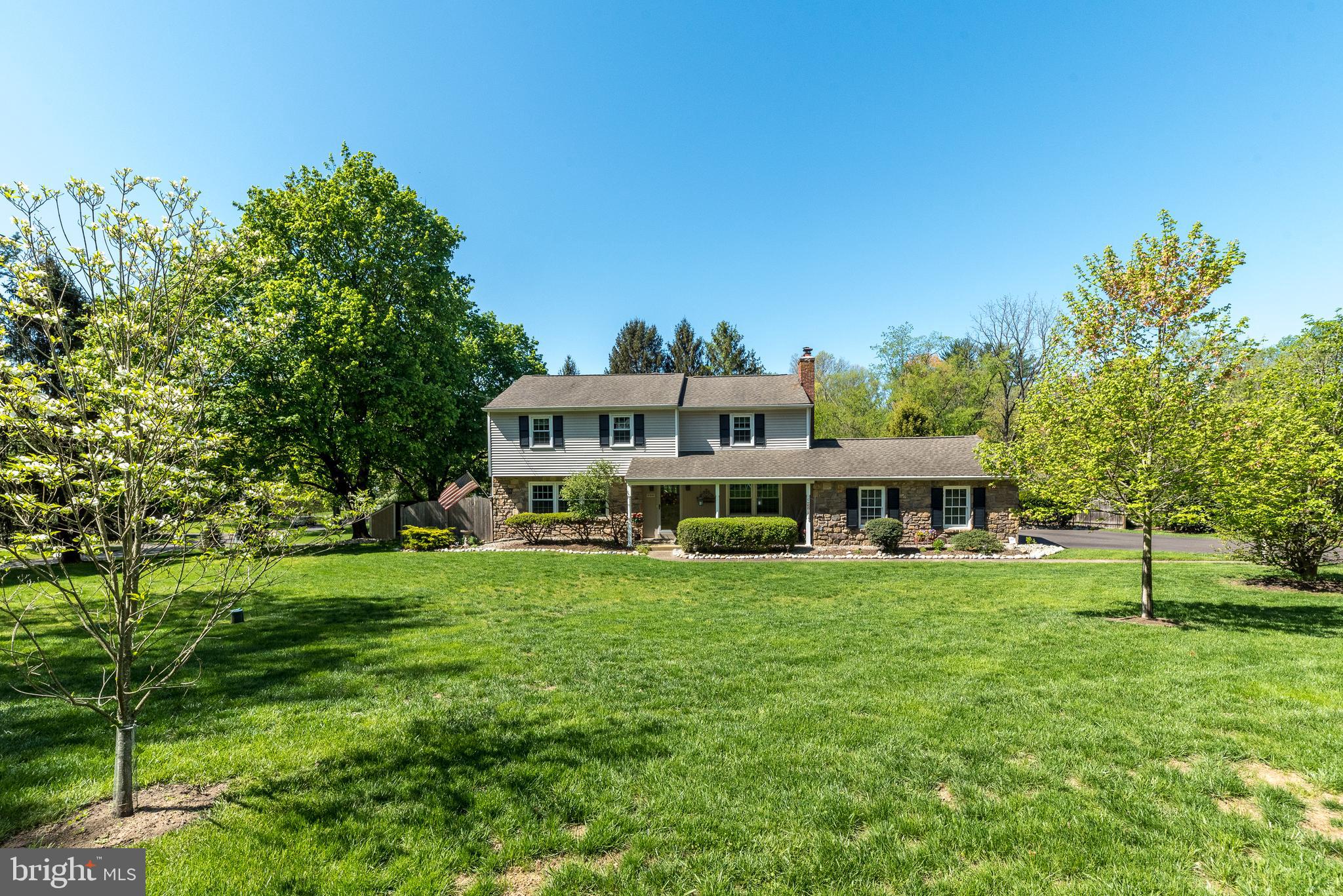 Welcome to 140 Short Rd, a stately 4 bedroom, 2 & 1/2 bathroom center-hall colonial nestled on 1 acre in the highly sought-after Pebble Hill neighborhood just outside of Doylestown Borough. As you approach the front of the home, you will be greeted by the inviting front porch & beautiful landscaping which all contribute to the curb appeal. Upon entering, you’ll be welcomed by beautiful hardwood floors that flow seamlessly throughout the home. The spacious sun filled living room opens to a formal dining room, perfect for entertaining or family gatherings. The gourmet kitchen is the heart of the home & a cooks delight. Equipped with stainless steel appliances, abundant new quartz counter tops, a large island with seating, and custom cabinetry, perfect for both cooking and entertaining. The kitchen opens seamlessly to a stunning sunroom addition surrounded by windows which provides a peaceful retreat, offering panoramic views of the beautifully landscaped backyard. A sliding glass door opens to the beautiful Blue Stone patio. The comfortable family room includes a cozy fireplace .The adjacent powder room has classic Bucks County Mercer tile on the floor. A large mudroom with convenient wash sink complete the main level. The second level features a spacious & inviting primary suite including a renovated bathroom with modern finishes & a generous walk-in closet with built ins. Three additional well sized bedrooms & a full bathroom complete this level. The parially finished basement offers additional flex space & plenty of storage. Outside, the expansive 1-acre lot is a true oasis, with mature landscaping, evergreens, and specimen trees that enhance the beauty and privacy of the property. It’s the perfect space for outdoor living, gardening, or simply enjoying the peaceful surroundings. This home has been meticulously maintained by its owners. Some of the many updates include quartz counters in kitchen, refaced cabinets, refinshed hardwood floors,new vanity & toilets, new front door & rear sliding glass door,waterheater,roof, full house generator & much more. Conveniently located just minutes from downtown Doylestown with restaurants, shopping , museums & train sation, this home offers the lifestyle you have been searching for. Schedule your showing today! One Year Home Warranty! Welcome Home!