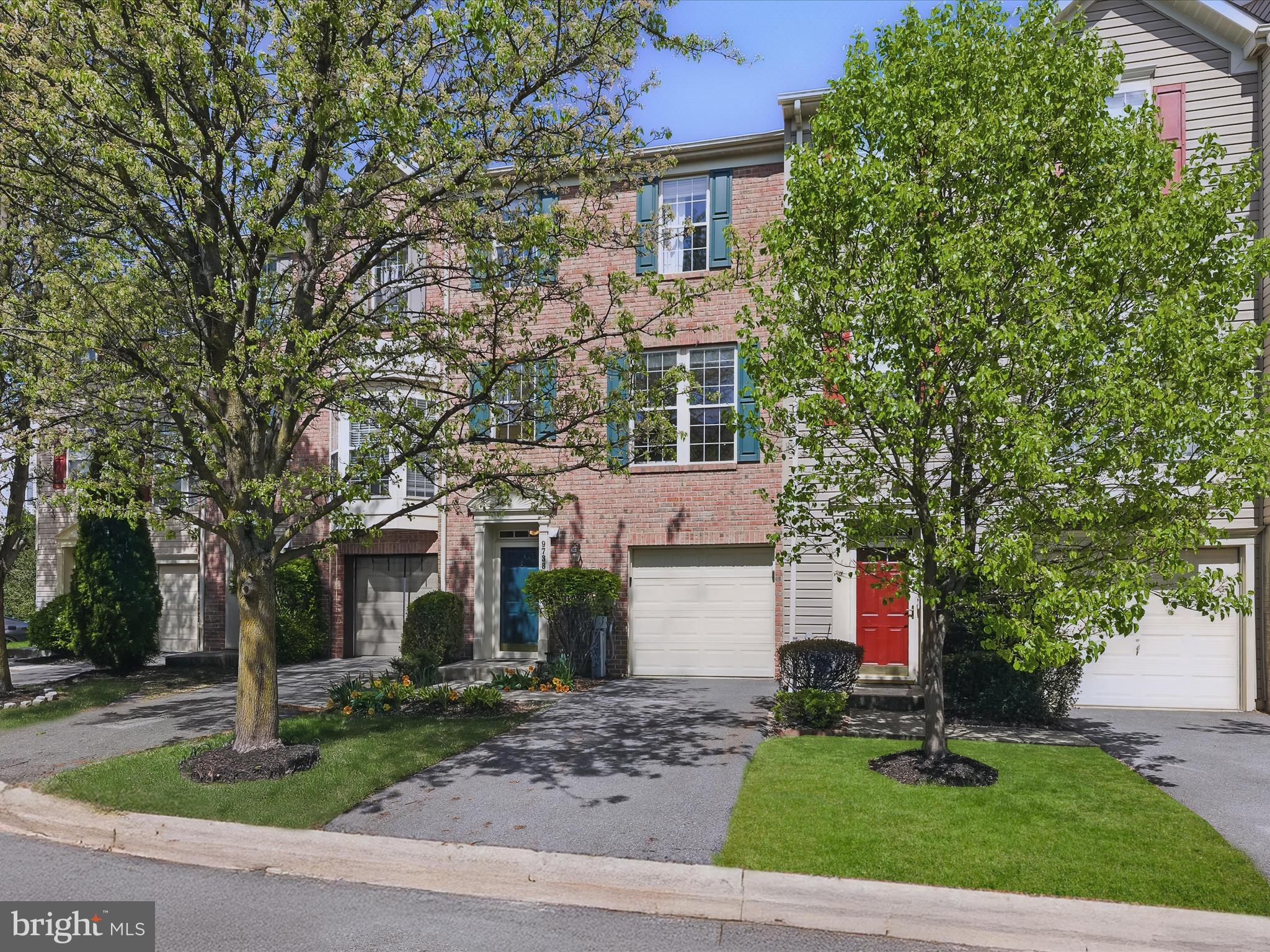 Step into your next chapter with this 3-bedroom, 2.5-bath contemporary townhome, offering a thoughtful open layout and modern conveniences. The entry-level features a family room, powder room, laundry/storage room, and garage access, making everyday tasks—like unloading groceries—effortless. Ascending to the main living level, you'll find a sun-drenched living room that flows seamlessly into the open eat-in kitchen. This inviting space boasts sleek, coordinating appliances, gas cooking, a decorative backsplash, 42” cabinetry, and a pantry providing ample storage. A kitchen island breakfast bar extends into a bright breakfast area, beautifully enhanced with custom box wainscoting and crown molding. Step outside to the custom brick patio, an ideal spot for grilling and outdoor entertaining. Upstairs the tranquil sleeping quarters include a primary suite with a soaring vaulted ceiling, ceiling fan, walk-in closet, and ensuite bath. The spa-like bathroom features a double-sink vanity, a luxurious soaking tub, and a frameless glass walk-in shower. Two additional versatile bedrooms offer flexibility, with a pocket door between them, allowing for an easy conversion back to a second primary suite if desired. A full hall bath completes this level. Updates include new roof (2018), water heater (2023) and 240V/EV charger in garage (2024). With these updates plus its prime location near I-95, I-695, and the many amenities of Honeygo, White Marsh, and Baltimore, this home offers both convenience and comfort—the perfect place to call home.
Note: Select interior photos have been virtually staged.