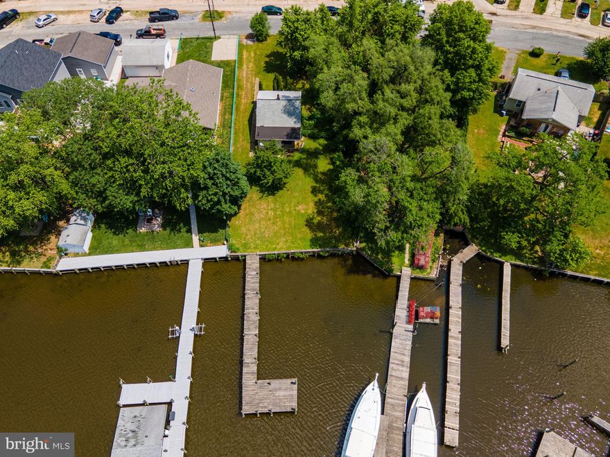 Welcome to 8023 Shore road. This waterfront property is situated in a secluded neighborhood on 1/3 of an acre. This home has 2 bedrooms, 1 bath and an unfinished  basement that could be finished. The basement walkout leads to  a leveled spacious backyard with a beautiful cherry tree and a 4 ft. wide pier waiting for your boat.  This property is an estate sale. Seller will make no repairs.