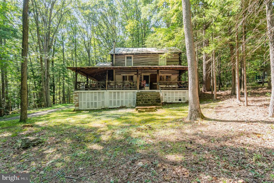 Must be a cash buy or use a line of credit, seasonal use, live here 9 months out of the year and move to Florida during those cold winter months, Big Spring Schools, Doubling Gap. This 1400 square foot log cabin home with 4 bedrooms, 2 full baths on almost a half-acre of leased land-10 years lease is $200 plus you pay your own real estate taxes of $1476 a year. Must be a cash buyer only. Property has indoor plumbing and septic-rare find. Seasonal use but does not say length of time you can stay out of a year. All of original hardwood floors throughout this beautiful home as well as logs. Wrap around porch, full kitchen, walking trails, hunting permitted in the State Forest. Across the road is a pond for fishing as well as Colonel Denning State Park- hiking- mountain biking-picnicking-swimming. Professional photos will be uploaded by Monday as well as floor plans and Park Lease by Monday.