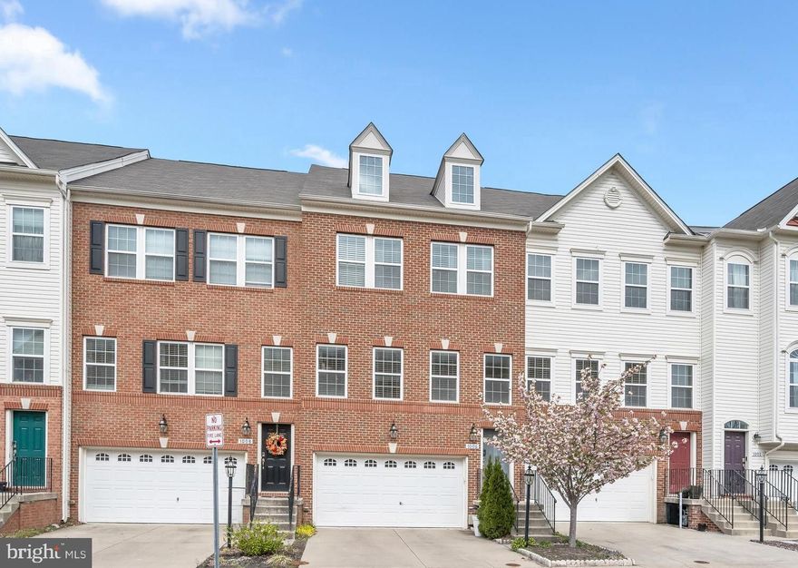 Spacious townhome in the sought-after Summerfield Village community offering a bright, open floor plan and thoughtfully designed living spaces throughout. The main level showcases wide plank flooring, elegant accent molding, and stunning pendant lighting over the dining area, creating a warm and inviting atmosphere for everyday living and entertaining.  The chef’s kitchen is the heart of the home, featuring a center island, peninsula breakfast bar, rich wood cabinetry, granite countertops, decorative backsplash, stainless steel appliances, a large walk-in pantry, and a butler’s pantry with wine storage. Step directly from the kitchen onto the expansive deck and enjoy picturesque views and peaceful surroundings backing to hiking trails.  Upstairs, the spacious primary suite offers a large walk-in closet and a luxurious en suite bath complete with a private water closet, dual granite vanity, and oversized shower. Two additional bedrooms, a hall closet, and a convenient upper-level laundry area complete this level.  The walk-out entry level provides a generous family room with sliding door to the backyard,  and a full bath, perfect for guests, recreation, or a home office.  Outdoor living shines on the expansive deck overlooking scenic views and nature trails. The community features a tot lot and is ideally located near major commuter routes, shopping, dining, and entertainment options.