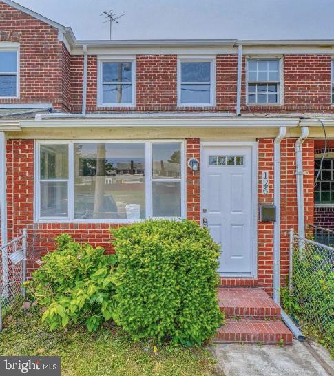 Welcome to 126 William Wade in Dundalk, MD. This Federal-style interior rowhome offers two bedrooms and one full bathroom. The home showcases luxury vinyl plank flooring, recessed lighting, and stainless-steel appliances. Additional features include central A/C, an attached carport, and available street parking.
