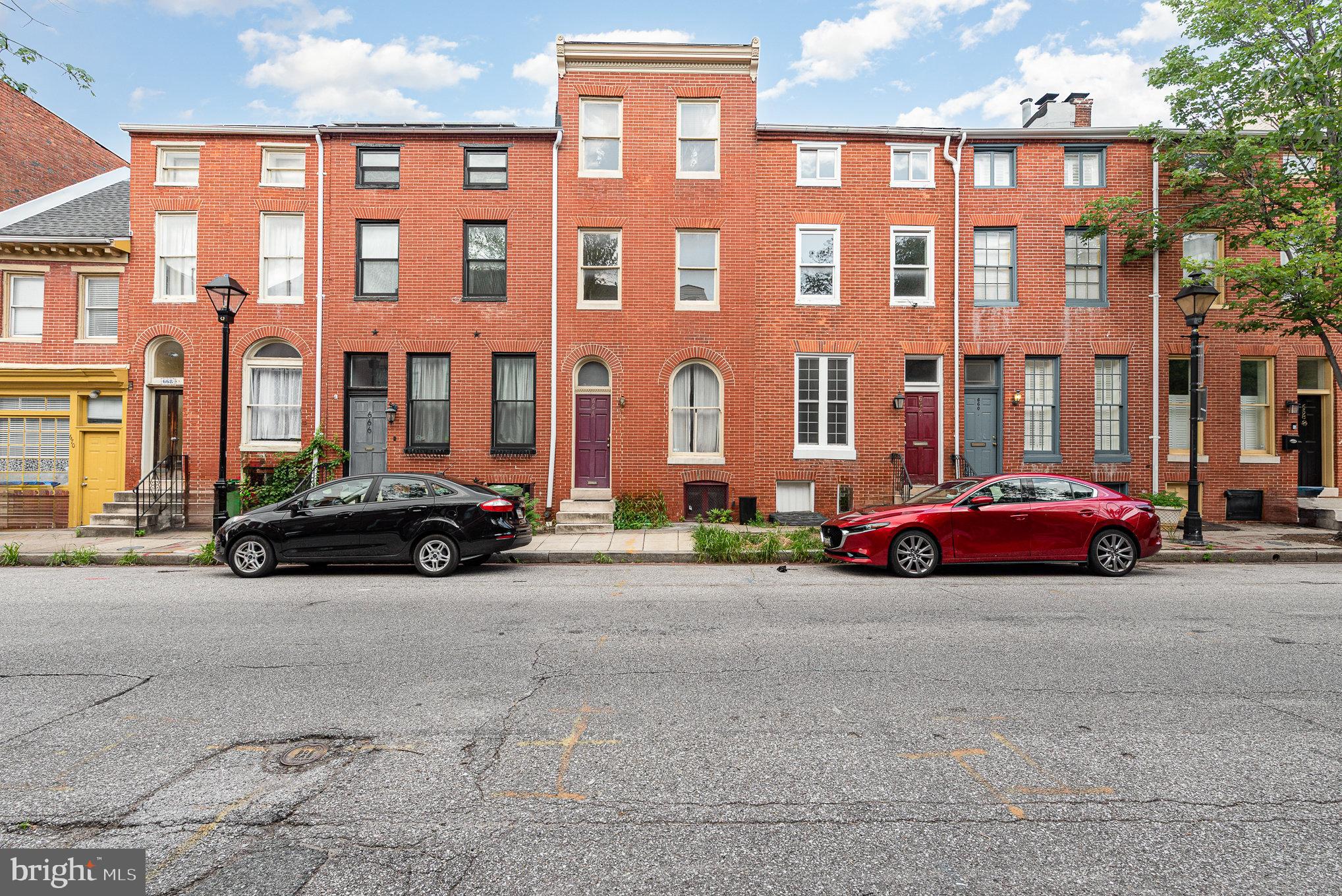 Welcome to this updated rowhome with two-car tandem off-street parking in the rear plus additional on-street parking for guests. Location, location, location! Ravens and Orioles fans, you're walking distance to Camden Yards and M&T Bank Stadium. Inside this home, the main level features a bright living room with Pergo flooring, recessed lighting, and a ceiling fan that flows seamlessly into the kitchen with a pantry. A dining area, convenient half bath, and main-level laundry complete the space. Upstairs, you’ll find two spacious bedrooms and two full bathrooms, while the top level offers two additional bedrooms—ideal for guests, a home office, or hobbies. Fresh paint and brand-new carpet throughout make this home truly move-in ready. There is easy access to Conway Street Park, Camden Yards, M&T Bank Stadium, the University of Maryland Medical Center and the Inner Harbor. Enjoy quick access to I-95, 295, light rail, Metro, MARC train, and several bus lines, easily connecting you to downtown Baltimore, Washington, D.C., NIH, and Johns Hopkins campuses. You're only a 15 minute drive to BWI.