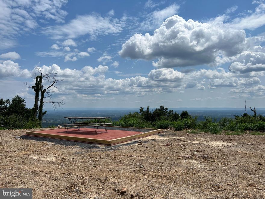 Owner Financing Available for a lower than current market rate with down payment!

Bring your imagination to this breathtaking 38 + acre UNRESTRICTED property with mountain vistas atop Radio Tower.  With a bi-level bungalow already in place, you can live in peace and serenity forever or while building your dream home!  With additional homesite possibilities, this gorgeous parcel will fulfill your mountain living dreams.  Fondly named "His and Hers" when used as an AirBNB, the house boasts a full bathroom on each level.  No sharing required.   The layout was designed to allow for possibilities.  Each level can be self-sustaining as a living unit if desired.  Currently. an upper and lower bedroom exist with flexible living spaces on each floor.   The double wrapped porches provide a view from the mountain shared only with the birds.   Stunning sunsets and morning bluebirds by your window may become a few of your favorite things. And, a brand new 16x36 metal building was just recently built on the property! 

Don't let this opportunity to own and build or invest and play pass you by.   Now is the time to own your WV mountain retreat.  Welcome to 390 Radio Tower where your imagination can go Wild and Wonderful.  Only 5 miles to Martinsburg, but feels like a world away for much needed relaxation! Book your showing today.