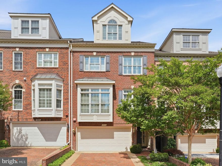 This stunning all-brick townhome combines timeless elegance with modern luxury, offering four levels of sophisticated living just minutes from Washington, D.C. Embrace scenic, seasonal views of the Potomac River from not one but two expansive decks, perfect for quiet mornings or entertaining guests.
Step inside to discover a sun-drenched interior, where oversized Palladian windows and soaring ceilings create an airy, inviting ambiance. The main living room features a gas fireplace and seamless access to the upper deck, while the formal dining room and gourmet kitchen—complete with premium finishes—set the stage for memorable dinners and gatherings.
The lower level elevates your entertaining  experience with a walk-out to the lower deck, a wet bar, built-ins, and another gas fireplace for added warmth and charm. Retreat to the luxurious primary suite, where cathedral ceilings, a gas fireplace, and double walk-in closets meet an exquisitely updated spa-like bath. Two additional bedrooms and two full baths ensure comfort and privacy for family or guests.
Completing this exceptional home is a two-car attached garage with a custom storage system, designed to meet the demands of modern living. From its classic architecture to its contemporary conveniences, this residence offers an unparalleled lifestyle in an unbeatable location. Close proximity to walk or bike to restaurants, entertainment and grocery.
