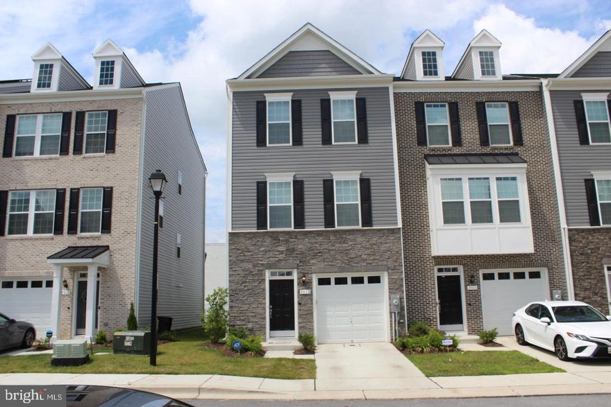 Opportunity to rent a beautiful, newer TownHome! Bright and spacious 3-level unit in the sought-after new community. With thoughtful upgrades, beautiful artistic frames, and beautiful wood flooring throughout.  Ground-level recreation room. Main level features an open floor plan with a dining room, kitchen, and living room combo. Powder room. Spacious kitchen with oversized cabinets, island, and stainless steel appliances. Sliding door off the kitchen leading to a large deck. Upper floor master suite with double walk-in closet, luxury master bath with dual vanities. Laundry room upstairs. 1-car garage. Very convenient location, close to NASA, U. Maryland, and USDA. Minutes to I-495, I-95.