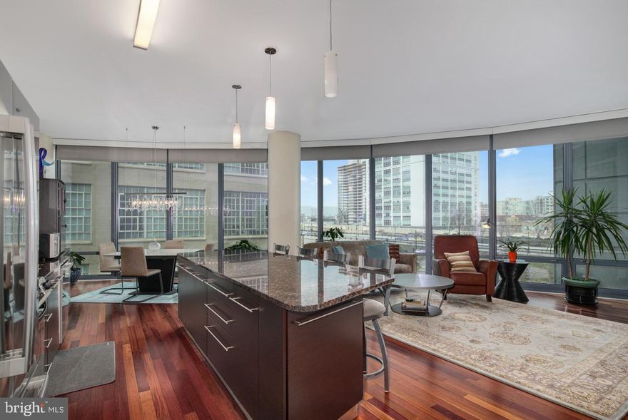 Welcome to 2101 Market Street, Unit 302 – a stunning, spacious, and thoughtfully upgraded north-facing residence in the prestigious Murano condominium. This beautifully maintained two-bedroom, two-bath unit offers 1,470 square feet of sophisticated city living, complete with 11-foot ceilings, gleaming Cherrywood floors in the main living area, and hardwood floors in both bedrooms. Modern luxury meets functionality with solar and electronic shades, upgraded stainless steel appliances, and a seamless open-concept layout designed for comfort and entertaining. The expansive windows flood the home with natural light while offering peaceful city views. The generous primary suite includes ample closet space and a well-appointed full bath, with the second bedroom and bath offering ideal flexibility for guests, a home office, or den. This residence also includes dedicated parking and additional storage, making it a rare and valuable find in one of Philadelphia’s most desirable high-rise buildings. Residents enjoy access to top-tier amenities including a 24-hour concierge, fitness center, indoor pool, and a sleek resident lounge.
Conveniently located steps from Rittenhouse Square, 30th Street Station, Trader Joe’s, and some of the city’s best dining, shopping, and cultural landmarks. Don’t miss your opportunity to live in one of Center City’s premier luxury buildings!