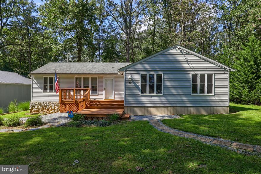 2 bedroom ranch home  on mature lot with landscaping and  privacy.   Conveniently located close to PA/MD state line.  Home features hardwood flooring, kitchen with breakfast bar island and high ceilings. Large  30x50 pole barn and rear deck.