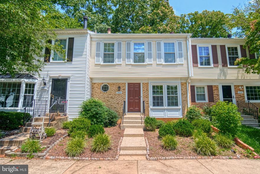 Spacious, move-in ready townhome, conveniently located off of the new Watkins Mill exit, boasts beautiful mahogany floors in the living and dining areas which open to the generous deck overlooking the spacious, fenced back yard. The kitchen is sunny and bright with eat-in space, a large pantry and ample cabinetry. Upstairs, the primary bedroom has a cathedral ceiling  and an updated, adjoining bathroom. The lower level has a large storage / utility room and a family room with a wood-burning fireplace and sliding glass doors to a lower deck / patio. Much of the home has been freshly painted. The heat pump was replaced The front and rear yards are cleverly landscaped to be low-maintenance -- no mowing to do! The community has loads of unassigned parking, a community pool, playground and tennis courts.
