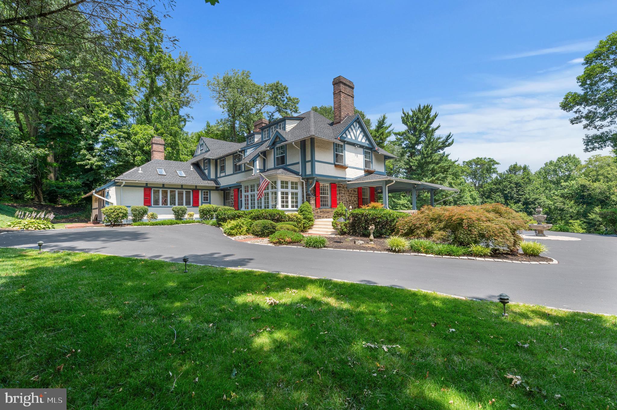 Great New Price for this beautiful Main Line estate commanding a stunning view to the top of a three-acre vista, surrounded by exceptional grounds and garden views. Eldoun is an example of the elegant homes built at the turn of the century by wealthy Philadelphians following the Main Line train tracks from the city. Built for a local doctor, this large Tudor style home has everything for a active lifestyle! Entertain with ease from the large wrap around front porch that leads to the stone patio behind the entire back of the house. This estate boasts room for hundreds and offers expansive living and entertaining space. Old world charm on the interior offers a variety of fabulous entertaining rooms, six fireplaces, hardwood floors, paneled solid wood doors throughout and an expansive kitchen and family room overlooking the property. This home has all newer systems, roof, gutters and electrical. The interior is freshly painted and move in ready! There is plenty of available parking with the long driveway and the circle which is at the top with the three-tier stone fountain. There is additional parking by the carriage house which has its own driveway. Eldoun is conveniently located in walking distance to Radnor train station, Radnor High and Elementary, downtown Wayne and Radnor for local shopping and restaurants and is within proximity to all major roads for commuting to Center City or the airport.Virtual tours are available! Check out our video tour! https://youtu.be/24WIjcZFssoA Please note that Delaware County is conducting a real estate tax reassessment, effective January 1, 2021.