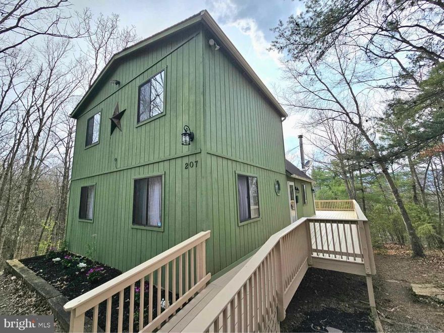 Welcome to 207 Mallard Dr, nestled just 5 minutes from Bryce Ski Resort. Enjoy the great outdoors surrounded by mixed hardwood forests and a gorgeous stone fireplace. The wrap-around deck invites you and your friends for a morning coffee or an evening cocktail, with amazing views of the mountainside. You’ll find an unfinished, partial basement with electrical hookups for all your storage needs underneath.

As you enter this stunning mountain chalet, you’ll be greeted by spacious vaulted ceilings and exposed hardwood beams. The floor-to-ceiling glass wall on the back of the home invites in warm sunsets, providing a plethora of natural light and ambiance. You’ll find an open concept living area adjoining your kitchen and dining room. The perfect layout for gathering friends and family in the home. Luxurious pellet stove included for alternative heating solutions. 

The expansive primary bedroom is located on the main level, boasting lots of natural light and space for any size furniture. The walk-in closet features plenty of room for storing clothes and recreational items. Walking upstairs to the balcony overlooking the living area, you’ll find two additional spacious bedrooms with another full bath to share. 

Recent updates made to the home, including but not limited to: new carpet on the upper level, new light fixtures throughout, downstairs bathroom has been updated, new ceiling fans, deck has been freshly stained, entire home freshly painted, and new kitchen appliances. Home can come fully furnished if desired, specified in offer if wanted. Perfect home for vacation rentals or full-time living.

Enjoy amenities galore such as the local ice cream stand, put-put golf, driving range, and Bryce Ski Resort. Bryce Ski Resort also offers a yearly mountaintop dinner experience at the peak of Bryce mountain. Nearby is Lake Laura, where you can rent a canoe for the day and go fishing. A short drive away, you can explore the Shenandoah Caverns with their stunning natural formations. For the wine lovers, there is a plethora of wine vineyards to explore and experience. If nothing else, enjoy a day biking, or hiking the gorgeous scenic mountains of the Shenandoah.