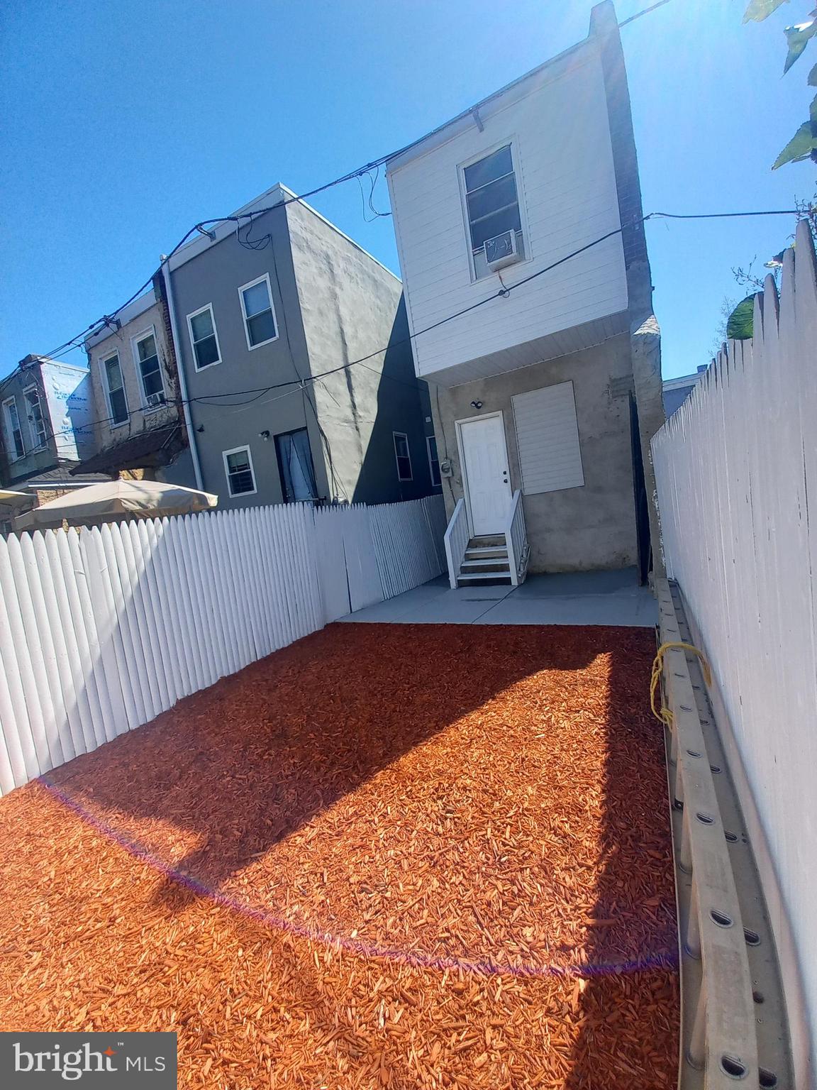 This is an end unit w/the option to buy the adjacent lot for a garage. Best of both worlds backyard w/a concreted sheltered patio & an open lawn to plant or to play w/out injury. All areas pictured, nothing to hide. Everything was gutted nice and new so no worry about repairs or replacement for years maintenance free. Parking is a breeze w/no day or time constraints. Train and buses are five minutes away. The gentrification from University City has started to spill over & create diversity and higher appreciation. Buy & flip or hold before it's too high. Low taxes. Premier gas heat for cheaper heating bills & longevity. No inferior electric baseboards to skyrocket your PECO. Buyer resp. New appliances included.