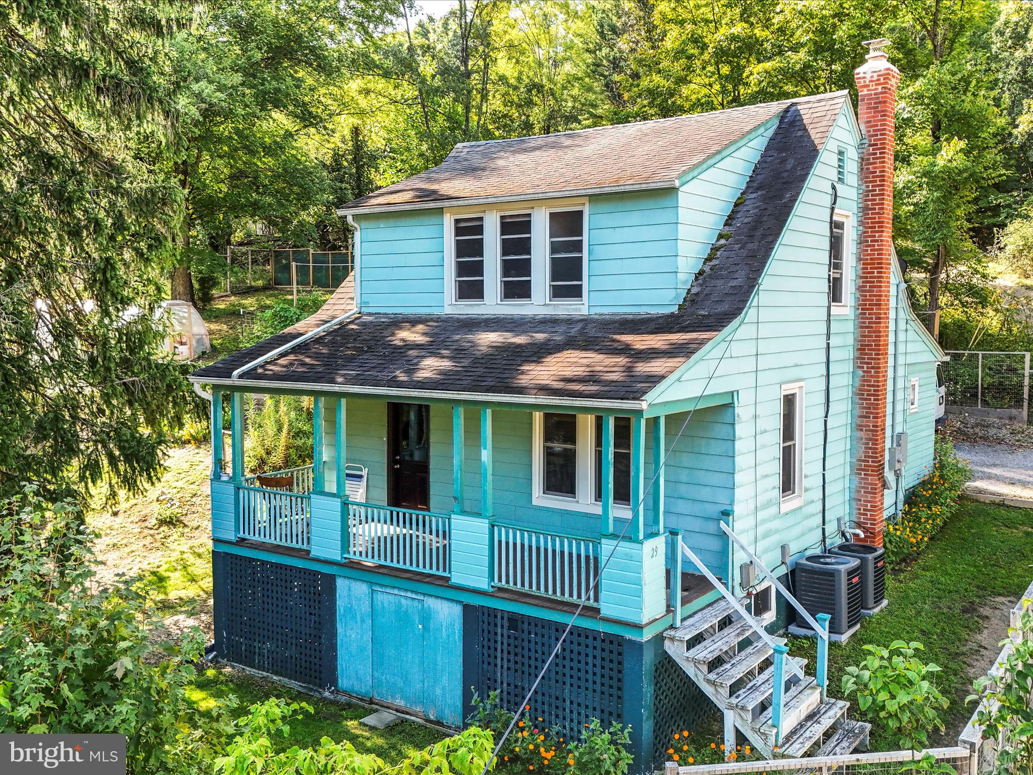 Country Living with all the Conveniences of Town! This 1/4 acre parcel includes most everything for a self sustaining homesteading. Multiple OMRI- Certified organic soil raised bed food garden, 16 ft. Green House, Chicken coop with fenced runs. 250 gallon food grade water tank, Garden shed. The entire lot is completely fenced with gate controlled entry, and has also had a recent recorded survey.
The home is bright and airy with many upgrades completed in the two past years, including but not limited to - FULL Electrical Rewire and 200 amp service, New central air, New gas furnace, Pellet Stove, Whole house surge protection, Upgraded plumbing. C.C. Security System.
This home retains the original wood trim and doors of a time gone by, the windows are insulated glass, double hung for comfort. The wood floors are original and have a warm glow. New appliances that include new gas range, washer and dryer, two chest freezers. For relaxation there is a new 4 person hot tub. While sitting on the front porch you'll overlook the surrounding area and feel as if you are within your own sanctuary.
Berkeley Springs WV, known for its Spas, Arts, Culture, Shopping and of course the Mountains and Rivers will welcome you to your new life, so make your appointment today!