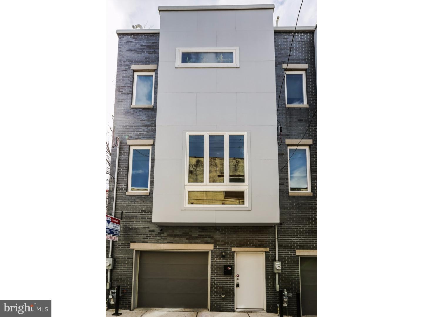 Do you want all the perks of new construction but without the wait? Come check out this beautiful 3 bedroom, 2.5 bath home in Northern Liberties with an attached garage, roof deck and approximately 6 years left on the tax abatement. Designed with tons of upgrades, this home has it all! As you enter this home there is hardwood flooring throughout and open floor plan. The living room features floor-to-ceiling windows, built-in cabinets, gas fireplace and a conveniently located half bath. The modern kitchen is complete with stainless steel Bosch appliances, granite counter tops, glass tile back-splash and a great island fitted with a wine fridge. The master suite offers a walk-in closet and spa-like en suite with rain shower head and whirlpool tub. The washer and dryer are conveniently located upstairs. Best part is your roof deck with unobstructed 360-degree city views.  This home also offers a finished basement with plenty of natural light and a guest bedroom and full bath right off of the attached garage. Located within immediate walking distance to Liberty Land Park, Honey's Sit-n-Eat, North Bowl, Standard Tap, and the Piazza. We welcome your visit today!