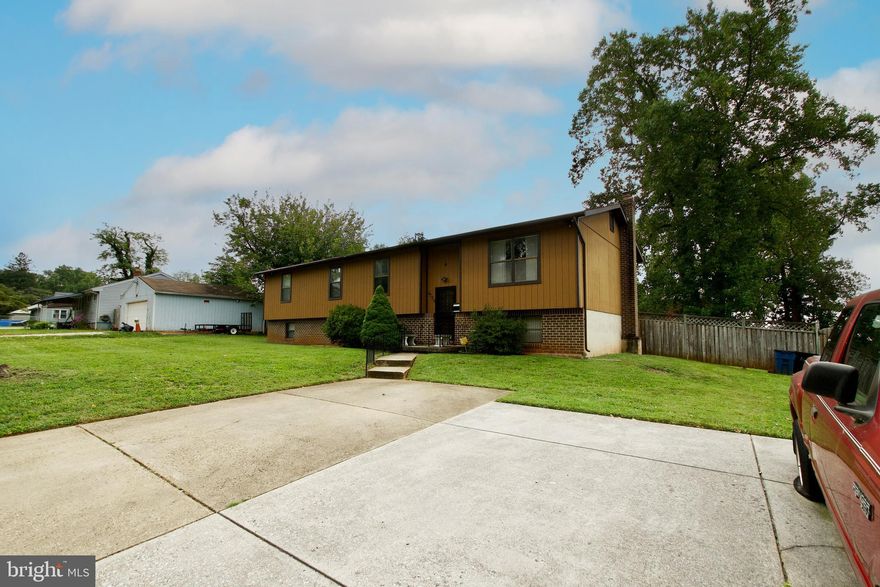 Welcome Home to this charming 5-bedroom, 2 1/2 bath split foyer single family home in the Brighton neighborhood of Baltimore.  This home sits on a nice large corner lot.  The upper level includes a kitchen with space for an eat-in dining and a formal living room and dining room.   Enjoy the summer on the deck just off the dining room.  The lower level provides ample recreation space, 2 bedrooms, 1 half bath and an office space with access to a spacious backyard ready for outdoor entertaining.  The heat for the recreational space is supplied through the pellet/wood stove.  PRICE REDUCED FROM PREVIOUS LISTING.  Property is being sold "As Is".  It's conveniently situated close to major thoroughfares, shopping, dining, and recreational areas.