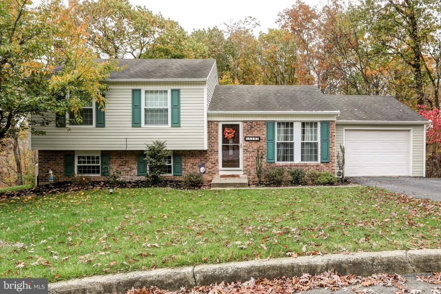 Private Setting / Cul-De-Sac. 3 Bedroom, 2 full Baths, Move-in ready home with new wood Laminate floors in Kitchen, Living Room and Dining Room. Dining Room has a sliding door that leads to a large deck overlooking yard. New Hardwood floors in Master Bedroom and Beautiful Shiplap wall in Guest Bedroom. New Kitchen Sink and Faucet. Downstairs has been completely renovated with waterproof laminate floors, Recessed lighting,Propane Stove, new Doors,  Laundry sink, built -in Liquor cabinet and new carpet on steps! Make this Home yours!!