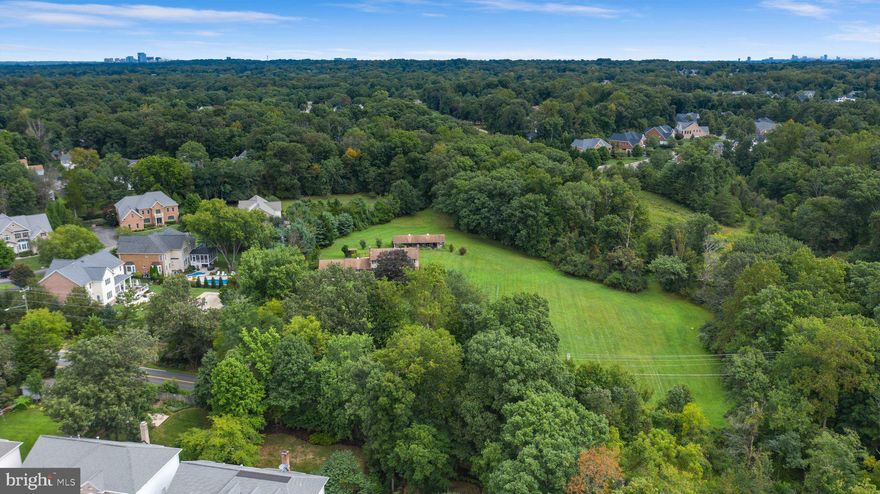 Beautiful 6.4 acres property. Fairfax County Zoned R-1 (Residential 1 DU/AC). Zoning ordinance allows Conventional and Cluster subdivisions. NO HOA. Existing home is well and septic, public water/sewer accessible (sewer easement on the property). Public water/sewer and gas connected to surrounding homes. Home is a Bi-Level design built in 1965 with a pool and barn. Highest and best use is subdividing the land. Oakton HS pyramid. Property borders Oak Hill Reserve and Camberley East subdivisions. Immediate access to Fairfax County Pkwy, close to Rt 28/50. Close to abundant shopping - Franklin Farm Shopping Center and Fair Lakes. New construction homes comp at $2+ million. Spectacular location! The site is ready to build your magnificent homes for enthusiastic, anxious buyers! Don't miss the link to the Drone Video!
