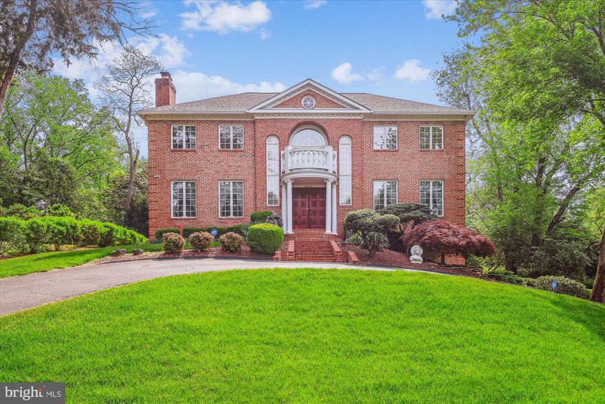 Nestled on a quiet cul-de-sac in the highly desirable Cedars of McLean, 1071 Spring Hill Road is minutes from Tysons Corner numerous attractions. Sited on a beautifully landscaped half acre lot providing a private outdoor oasis featuring a substantial wrap around tiered deck with capacity for 75+ people —this home is an entertainer’s dream! Elegant finishes and modern comforts define this meticulously maintained home boasting over $355,000 in recent upgrades, including: NEW roof and gutters (2022), 2 NEW HVAC units (2024 & 2023), NEW hot water heater (2022), NEW Bray & Scarff appliances (2025), whole house plumbing upgrade (2005). Cosmetic upgrades include: Extensive granite flooring installation (2005), professionally landscaped (2025), deck painted (2021), deck expansion (2005), exterior brick and concrete maintenance (2022), primary bathroom hardware replaced (2024), selective painting throughout the home, a dumbwaiter to move groceries from the garage to the kitchen, and more! Prepare to be impressed! The grand two-story entry welcomes you with elegant Palladian windows, solid wood double doors, a chandelier, and dual staircases guiding you to the upper level. This opulent all brick colonial, provides 5,828 square feet of light-filled living space with 5 bedrooms, 4 full baths, and a powder room.
 The gourmet kitchen boasts a breakfast area framed by windows with a walk-out to the deck and backyard. A chef’s dream, it showcases a center island with a cooktop and breakfast bar, a second cooktop, dual wall ovens, a butler’s pantry, modern white cabinetry with matching appliance panels, and a bonus workstation. The family room sits at the heart of the home and flows into the kitchen. A classic den, formal dining and living rooms, and a powder room complete the main level.
The upper level offers four bedrooms, three full bathrooms, and a convenient laundry room. The spacious owner’s suite features a fireplace and two walk-in closets. The en-suite bathroom is finished with a modern tile surround and includes a glass-door steam shower, separate vanities, a jetted soaking tub, and a private water closet.
The expansive recreation level with a full wet bar provides abundant flex space, perfect for a lounge, game room, or in-law suite. Additionally, this level includes a bedroom, a full bathroom, and access to the attached two-car garage.
Prime location, minutes from Tysons Corner, with an abundance of dining, shopping, and entertainment options. Convenient to numerous parks, recreational facilities, and nationally rated golf courses—perfect for outdoor enthusiasts. Walk to Spring Hill Rec center offering aquatic facilities and more! Top-rated schools enhance the appeal. Don’t miss the opportunity to own in one of the DC area’s most sought-after neighborhoods!