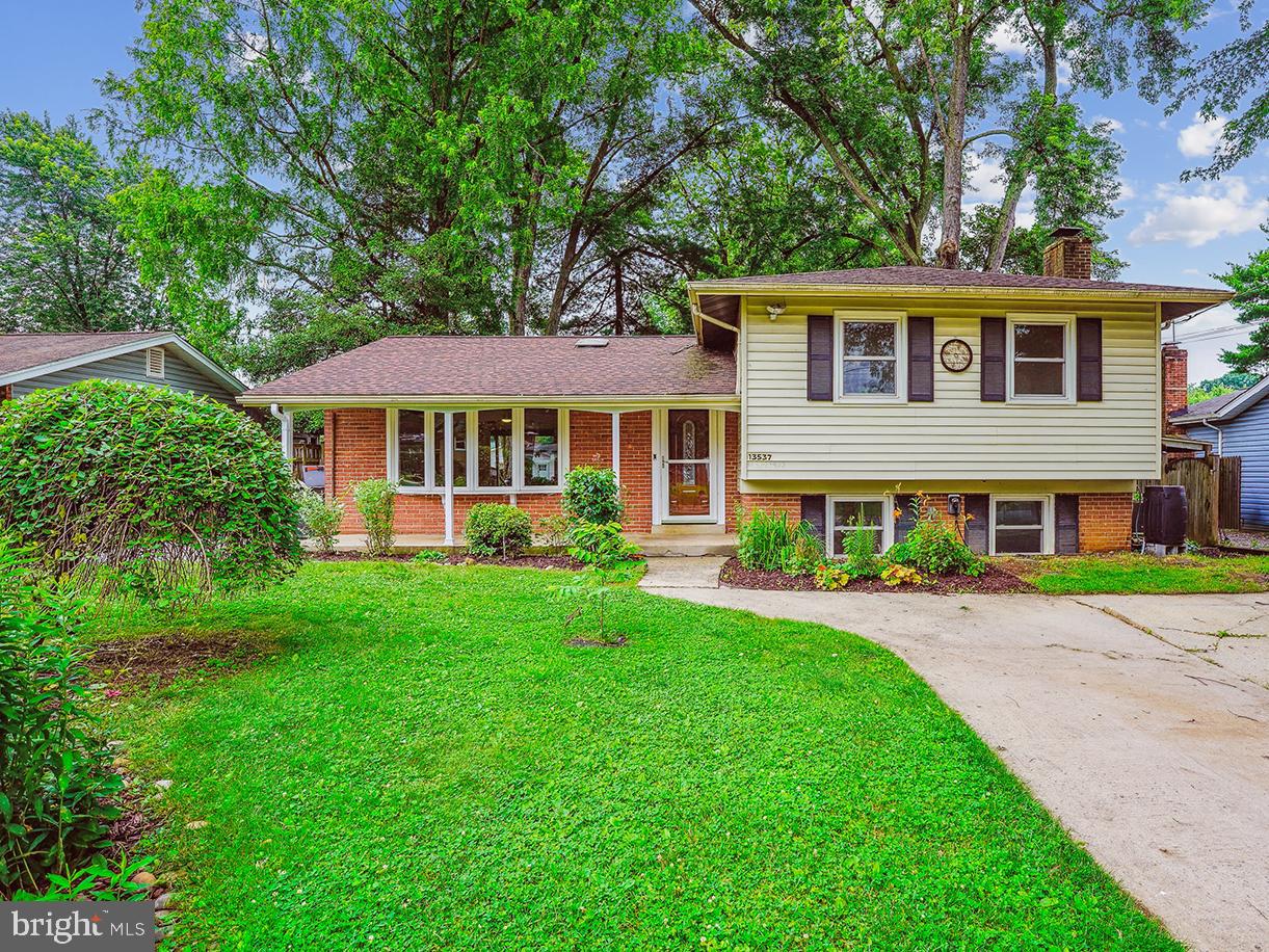 Welcome home to this well-maintained, uniquely spacious for the neighborhood, 4 level, 3 bedroom plus study/4th bedroom, 3 full bath split-level home, perfectly situated on a lovely fenced-in lot with low maintenance rainscape garden and native plantings. The home features an outdoor oasis that includes a beautiful expansive covered deck overlooking the rear gardens with shady mature trees, including a redwood tree! Ideally located in convenient Wheaton Woods, it is nestled near the picturesque lakes, woods and trails of Rock Creek Park; minutes from schools and places of worship; and Pike & Rose and Rockville Town Center shopping. Metro and major commuter routes. Lovingly cared for and updated with 240 volt EV charger plug in, NEW roof, HVAC, replacement windows, kitchen, baths, flooring, paint and fixtures, this home is turn-key and ready to move in!
FEATURES & AMENITIES
• 3 bedrooms, including primary bedroom suite, 3 full baths, and a study/4th bedroom
• Welcoming foyer, beautiful new door and convenient wifi-enabled keypad lock, features ceramic tile floor
• Sun-filled main level features a formal living room with new bright and light-filled casement bow windows with seating, casting their view out onto the beautifully landscaped yard; trendy dual fan light and a solar tube for lighting; hardwood floor, and easy flow to the dining room featuring hardwood floor with designer ceiling fan
• The spacious gourmet kitchen features a beautiful glass tile backsplash, under mount sink, stainless steel appliances, including solid surface glass top stove, expansive granite countertop, white easy-clean cabinets, and additional wall of cabinets with long countertop, solar tube lighting, and ceramic floor; and glass door, which opens to the covered deck, perfect for relaxing and entertaining with family and guests; go out unto your deck rain or shine and enjoy the beautiful mature trees, including a real redwood tree!
•Dining room with designer ceiling fan & new sliding glass door to the covered rear deck so come rain or shine, you can enjoy being outdoors any time, enjoying your cup of coffee or other refreshing beverage of choice
• Primary bedroom with sparkling hardwood floor, ceiling fan, abundant double-door closet; incorporates a remodeled en suite primary bathroom with luxury ceramic tile, designer lighting, and granite vanity
• Three additional upper level bedrooms with gorgeous hardwood flooring, ceiling fan lighting, and spacious closets
• Upper level hall tub and shower bath with solar tube and designer vanity lighting, new fixtures, expansive designer granite vanity; convenient hall linen closet nearby
• Warm and welcoming family room with gorgeous picture frame wainscot molding, brick wood-burning fireplace, designer lighting and new carpet and windows with a vista view to the beautiful front gardens
• The lower level study/4th bedroom with custom solid-wood built-ins, adjacent to the family room and nearby full bath has new carpeting and features its own side entrance
•Lower level remodeled full ceramic shower bath with linen closet and pedestal sink and vibrant vinyl floor
• Lower level II features a recreation gaming/media room, perfect for entertaining and relaxing with family and friends; vinyl floor and abundant lighting, large closet to build out for storage
•Lower level II laundry off the rec room with handy walk in storage closet and shelving, vinyl flooring and
• Some of the special features of this home include a nicely level fenced yard with native plantings and rain scape garden in the front, mature trees including a Redwood tree in the rear yard; brick wood-burning fireplace and exterior vinyl siding with brick; solar tube lighting, new replacement windows and doors; remodeled kitchen and baths; carpeting and hardwood flooring; entire interior and exterior has been freshly painted. Turn your key, unpack, and enjoy your new home! See brochure for Improvements List!