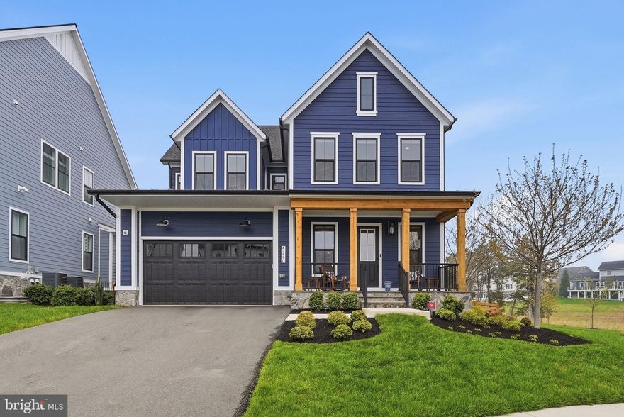 Luxury living meets modern functionality in the highly desired Hartland’s Community.  
Welcome to this stunning Grandin III Contemporary Farmhouse style home by Van Metre, where sophisticated design meets everyday comfort. This home is loaded with premium upgrades, including high-end flooring throughout, extra windows and soaring 10-foot ceilings that amplify the natural light. Designed for the modern professional, the main level features a private office with a stylish barn door, ideal for a work from home sanctuary. The open concept living area flows seamlessly into the great room, anchored by a cozy gas fireplace flanked by windows. The gourmet chef’s kitchen is a true showpiece, boasting custom style cabinetry, an oversized center island, double wall ovens, a walk-in pantry, and an upgraded appliance package. A large mudroom with custom built-ins ensures effortless organization. Escape to the private primary suite, complete with an expansive walk-in closet and a spa like bath featuring the free standing soaking tub, dual vanities and an oversized walk-in shower. Three additional spacious bedrooms, two more full baths, and a dedicated laundry room with built-in cabinetry complete the upper floor.  The finished walk up lower level is an entertainer's dream, featuring a spacious recreation room, a 5th bedroom, a 3rd full bath, and a dedicated exercise room. Step outside to your private oasis: a newly fenced backyard equipped with a professional irrigation system and custom landscaping.
This home is nestled in the prestigious Hartland community, enjoy world class amenities including a clubhouse with a great room, fitness center, playroom, and locker rooms, as well as a competition sized pool. The area also has a playground and multi use sports courts to include tennis, basketball, and pickle ball. Call today for a private tour!