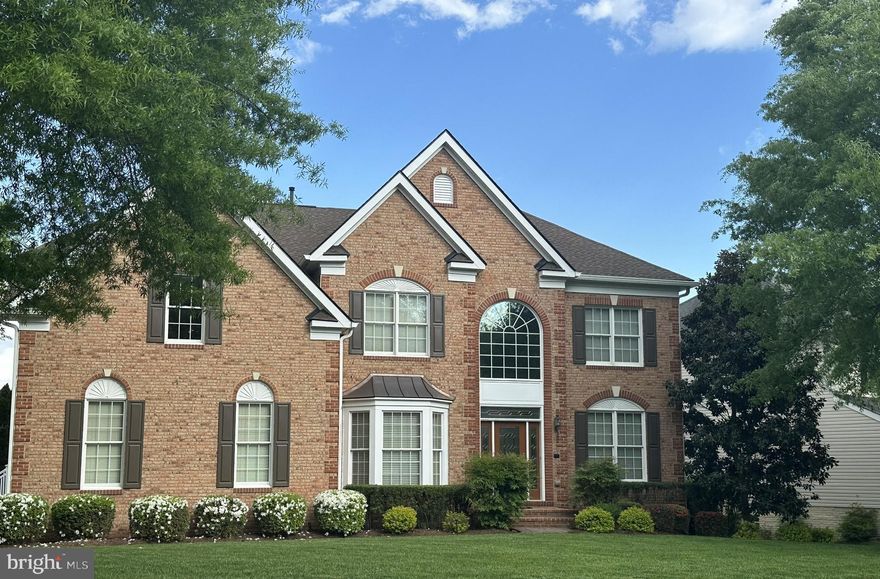 Prepare to be captivated by this exceptional residence offering seamless integrated living. Control your ambiance with a whole-house smart system for multi-room audio, security & more. Retreat to a luxurious Primary Suite with sitting area, spa-like bath (soaking tub, cathedral ceiling), and expansive walk-in closet. Entertain effortlessly in the enormous dining room and wet bar, spacious kitchen, sunroom, or al fresco under the deck's pergola. The sun-drenched, walkout lower level is an entertainer's dream or ideal in-law suite, featuring a massive bar (wine cooler, fridge, microwave), full bath, endless daylight, and flexible space for a gym or theater. Tranquil meditation garden & stunning exterior lighting complete this private oasis.