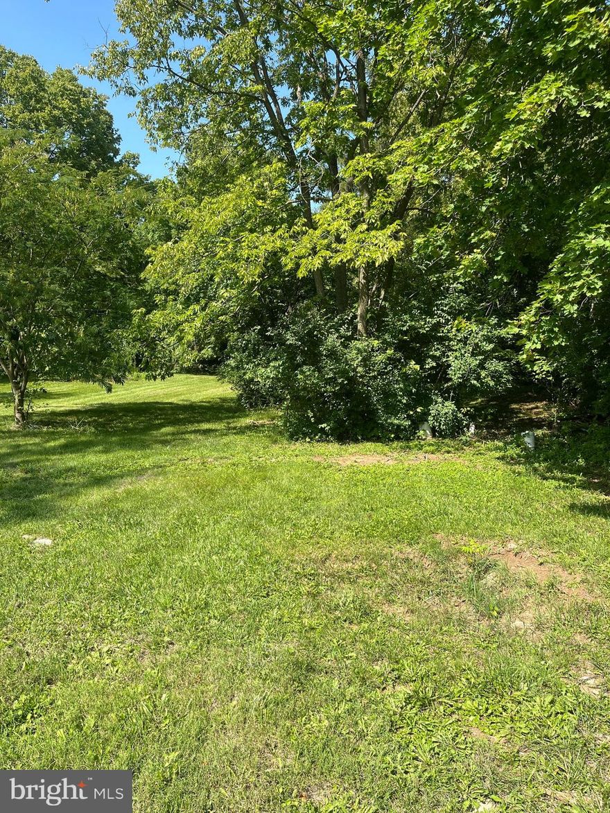 This park like setting lot is a great place to build and enjoy your dream home while you listen to the babbling creek. This lot has an approved perk test and a well so you are ready to build your new home.  This flat, nice in town lot consists of  .79 acres that goes to the creek .This building site has multiple out buildings for storage.  A must see area. Make an appointment today.