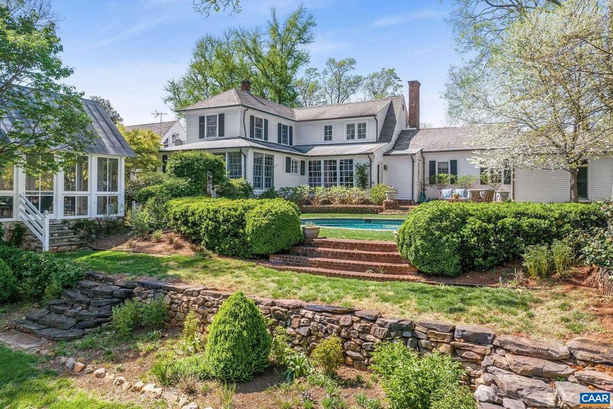 Original name derives from the Scottish name ?Windie Knob?, due to its ?lofty elevation that gathers the cooling breezes of summer and the cold piercing winds of winter.? Historic 1732 Colonial Farmhouse on 24 Acres ? Minutes from Downtown & UVA- This charming 1732 Colonial farmhouse offers 24 acres of rolling, tree-shaded lawns and fenced pastures, perfect for horses. The home features a gourmet kitchen, spacious family room with 10? ceilings, five fireplaces, and hardwood floors throughout. The primary suite adjoins a cozy library/office with a fireplace, while upstairs offers three bedrooms and two full baths. Enjoy outdoor living with a terrace, pool, dining pavilion with stone fireplace. A guest cottage with three bedrooms, two baths, and a fireplace, additional out buildings complete this exceptional property. A rare blend of history and modern comfort, just minutes from downtown and UVA!,Granite Counter,Painted Cabinets,Fireplace in Bedroom,Exterior Fireplace,Fireplace in Family Room,Fireplace in Living Room,Fireplace in Study/Library