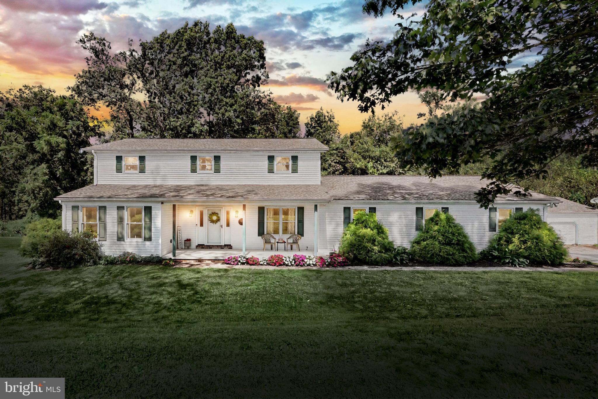 Custom-Built 2-Story Colonial on 1.56 Acres. Welcome to this beautifully maintained custom-built colonial nestled on 1.56 acres, surrounded by peaceful farmland and woods. Enjoy stunning views and the beauty of nature from your covered front porch, all while being just minutes from I-83 for an easy commute to Harrisburg, York, or Maryland. This spacious home offers 3 bedrooms and 3 full baths, including a private primary suite. Inside, you’ll find a warm blend of hardwood and carpet flooring, solid wood interior doors, and thoughtful touches like hardwired window candles and staircase lighting. The granite kitchen countertops, stainless steel appliances (all included with the sale), and spacious layout make the kitchen a perfect gathering spot. The main level provides both a living room and family room, complete with a pellet stove, as well as a first-floor office. On both floors, you’ll find extra-wide hallways, a convenient second-floor laundry (washer and dryer included), and generously sized bedrooms. The home is built with 2x6 framing for energy efficiency and includes a heated sunroom overlooking the fenced backyard. Additional living space includes a large game room with an 8 ft. pool table (included) and a full basement with new Bilco doors, perfect for storage or future expansion. Car enthusiasts and hobbyists will love the 2-car attached garage with extra storage, plus a detached 1,400 sq. ft. 3-bay garage with heat, electric, and 10 ft. ceilings. There’s also ample off-street parking for guests. Other upgrades include a newer 2-zone heating and cooling system, and a 3-year-old roof, gutters, and downspouts on both the house and detached garage. This home truly combines comfort, craftsmanship, and convenience—offering both modern amenities and timeless design.