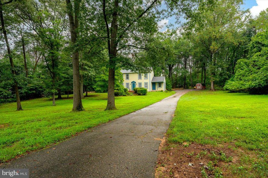 Professional pictures coming this week. Nestled on a serene two-acre lot, this beautifully maintained 3-bedroom, 2.5-bath home offers the perfect blend of classic character and thoughtful updates. Step inside to discover gleaming original hardwood floors that have been professionally refinished, adding warmth and elegance throughout the main living areas. The kitchen features brand-new flooring and plenty of space to make it your own culinary haven.

The main level welcomes you with a spacious foyer, formal dining room, cozy family room with a wood-burning fireplace, and a versatile office or living room. A convenient half bath and access to the newly installed composite rear porch make entertaining a breeze.

Upstairs, the private primary suite includes its own full bath, while two additional bedrooms share a second full bathroom—ideal for family or guests. The unfinished basement houses the washer and dryer and offers endless potential for customization, whether you're dreaming of a home gym, workshop, or extra living space.

Additional highlights include a recently serviced heat pump and well system for peace of mind,
Gutter guard system for low-maintenance exterior care, expansive yard perfect for gardening, play, or quiet relaxation.

This home is move-in ready and waiting for your personal touch. Don’t miss the opportunity to own a slice of tranquility with room to grow!