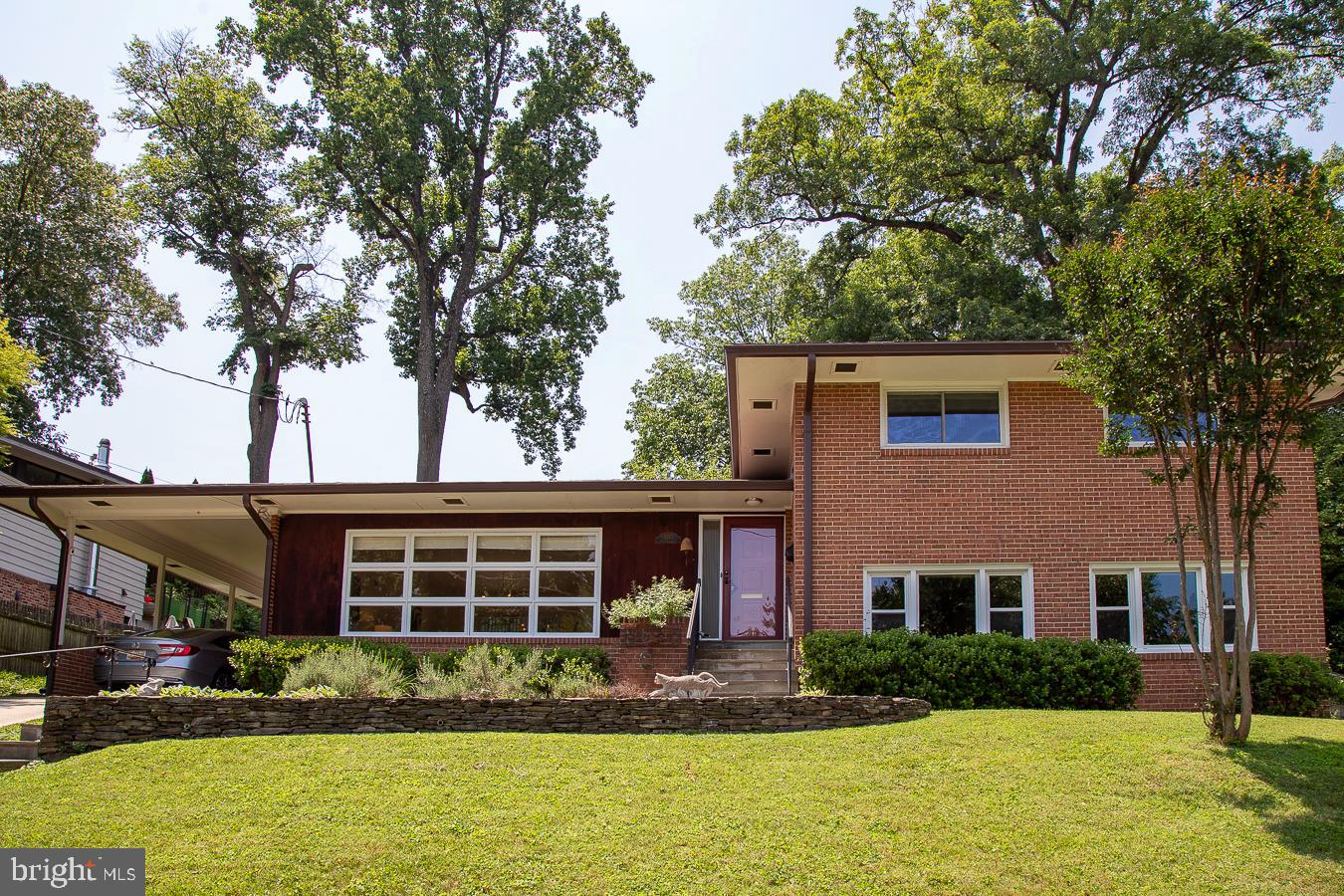 Classic mid-century modern split level with lots of space and light. This southern exposure with lots of windows, lets the sun comes streaming in. The step down living room with high ceilings opens to the dining room. Sliding glass doors from the dining lead to a wonderful slate patio and private yard, perfect for entertaining. The updated kitchen has new quartz countertops and a perfect table space area. There are pretty oak hardwood floors are on this level and the bedroom level. Upstairs are three bedrooms and two baths. The classic baths, one pink and one blue are a snapshot in time. Keep them or renovate, the choice is yours. Take a few steps down from the entry level to a spacious wood paneled family room with full sized windows along the front and a gas fireplace. The fourth bedroom and another full bath, complete this floor. There is a lower basement area with laundry, lots of storage and room for whatever projects you want to work on. Freshly painted you can move right in. Convenient to Bethesda, Silver Spring, downtown DC; location is ideal. And for nature lovers, it is oh so close to Rock Creek Park and all that the park has to offer.