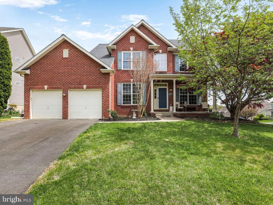 This is the home you have been waiting for!  Recent updates include new upper windows, kitchen appliances/refresh in 2024, radon mitigation in 2022, tankless water heater in 2021, sump pump in 2019, HVAC and 50 year shingle roof in 2018. Move right in and start relaxing and entertaining whether you prefer coffee on the front porch, or cool drinks on the back deck! The gorgeous main level offers versatile living spaces with a private front office with French doors as well as a separate front sitting room.  In addition to the recently updated kitchen with new stainless appliances & stylish custom painted cabinets with convenient pull out shelves, this level also boasts an elegant formal dining room with bay window, ceiling fan, chair rail & crown moldings, a large family room with fireplace, & a bright breakfast/morning room with plantation shutters, ceiling fan, & access to the sunny back deck.  The oversized mud/laundry room has plenty of cubbies & shelves for everyone to organize their belongings, and the attached 2 car garage includes a level 2 electric vehicle charging station. The beautiful wood staircase leads to the bedroom level, with all new windows.  The spacious primary suite is sure to impress with its wood floors, walk in closet + an additional closet, huge bathroom with soaking tub & separate shower.  The upper level also includes 3 additional sizable bedrooms & a full hall bath.  The lower walk out level is expansive & perfect for an in law or nanny suite.  Enjoy the recreation room, kitchenette, second laundry, 5th bedroom & 3rd full bath as well as tons of storage space.  Move in just in time to take advantage of the 3 community pools, walking trails, lake, elementary school, close proximity to restaurants, Downtown Frederick, all major commuter routes, grocery, shopping and more! Don’t miss this opportunity to own a beautiful home in a vibrant community. Schedule your tour today and experience the warmth and comfort this property has to offer!