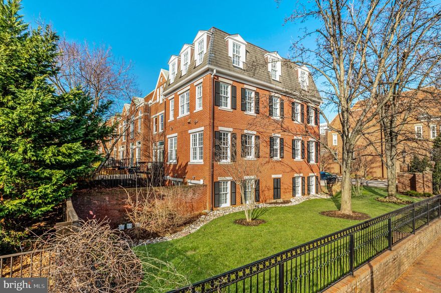 Open Sunday, 2/26, 1 - 3 pm! Enviably sited on a high corner lot in Georgetown’s West Village, 3500 Winfield Ln NW is an elegant custom designed Federal rowhome showcasing artful interiors, breathtaking Washington Monument, campus, and Rosslyn views, with remarkable curb appeal to match. Offering the epitome of luxurious Georgetown living, this sensational showpiece features 3 bedrooms, 3 full bathrooms and 2 half bathrooms spanning 4 levels and 3,770 total SF. A stately brick façade with plantation shutters and a professionally manicured side garden welcome you into the light filled rowhome complete with designer detail, high ceilings, crown moldings, recessed lighting, and custom flooring throughout. The Main Level’s Principal living spaces boast 10’ ceilings and gleaming hardwood flooring and seamless flow for easy entertaining. The Dining Room, with upholstered walls of red silk and tray ceiling, opens to the Gourmet Kitchen complete with Medallion wood cabinetry, Viking appliances, and Perrin & Rowe fixtures. Adjoining the Kitchen, the expansive Living Room features 11’ ceilings an abundance of large windows that flood the room in natural light. A custom, burled wood staircase leads to the sprawling Primary Suite that extends across the entirety of the second level. The spacious Primary Bedroom features hardwood floors and tray ceilings and overlooks the garden from its multiple windows; two outfitted walk-in closets lead to the enviable Primary Bathroom complete with marble flooring and wainscoting, clawfoot soaking tub, large stall shower, double vanity,  and separate water closet. The Top Level offers incredible treetop, city, Visitation and Georgetown University campus views from its two additional ensuite bedrooms and includes a Laundry Room. The perfectly appointed Terrace Level features a 400+ bottle wine cellar and large Family Room, complete with slate flooring, a gas fireplace, and home theater system. Two sets of French doors open to the charming, private brick walled rear patio with a built-in Viking grill, an ideal setting for iconic Georgetown style garden parties or al fresco family dining. An attached, one-car Garage is accessible from the Terrace Level, with additional exterior parking for 2 cars. The residence is outfitted with a Sonos Speaker system.