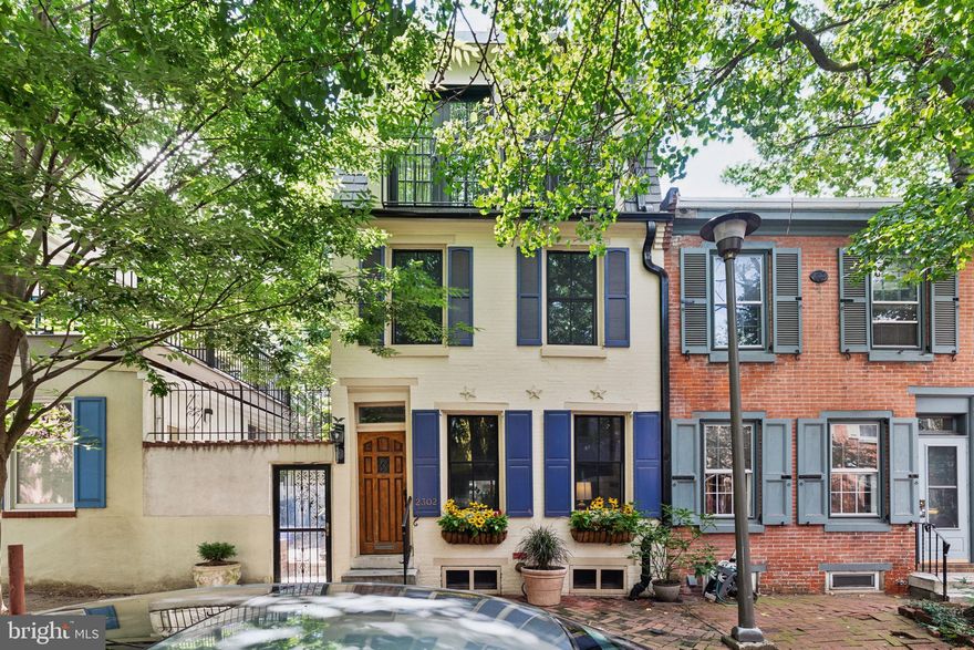 Situated on a charming block in one of the most sought-after neighborhoods in Philadelphia, this
Fitler Square gem features 4 bedrooms plus a large den, 3 and a half bathrooms and 3 outdoor
spaces including a two-tiered roof deck. As you stroll down tree-lined Waverly Street, you will
instantly fall in love with this quiet and neighborly block. With its white brick façade, cheery blue
shutters and beautiful window boxes, this home’s curb appeal is on point. Enter the home
through the vestibule and you will be immediately impressed by the open floor plan with original
hardwood floors, tall ceilings, and plenty of light. The living room features two large windows, a
brick fireplace with mantel, and beautiful floating shelves to display your treasured home decor.
The spacious dining area comfortably seats 6 under a mid-century gold chandelier. Continue to
the recently remodeled kitchen which boasts ample navy cabinetry with gold hardware, a quartz
island, a six-burner Viking range with hood, above-range pot filler, and a 15-bottle wine fridge.
Any home cook will love creating culinary masterpieces in this spacious and well thought out
kitchen. A large sliding glass door leads you to the first of three outdoor spaces, a recently-
installed paved back patio with overhead lighting that is perfect for dining al fresco. On the
second floor you will find two nicely sized bedrooms with good closet space, a hall bathroom
with a combination tub and shower, as well as a laundry room, with extensive cabinet and
countertop space, that rivals those you will see in the suburbs. The third floor is home to a
fourth bedroom that makes the perfect home office or nursery, as well as a primary suite which
is large enough to accommodate a king-sized bed. A spacious walk-through closet leads you to
the gorgeous bathroom which boasts a double vanity, a marble herringbone tiled floor, and a
large walk-in double shower, all in a calming white and grey color palate. The fourth floor den is
a true show-stopper where you’ll love entertaining friends or cozying up as a family for movie
nights. Conveniently equipped with a sink, beverage fridge, kegerator, dishwasher, and half
bath, you’ll have everything you need for entertaining at your fingertips! So bright and airy, this
room is both stunning during the day and at night with views of the Center City skyline from the
two roof decks. The upper roof deck will quickly become one of your favorite places to watch the
sun set over Philadelphia while you sip on cocktails with friends. The unfinished basement has
an additional washer and dryer as well as a full bathroom which is the perfect place to bathe
your family’s furry friend. This home, located in the Greenfield Elementary catchment, is just a
half block away from Fitler Square Park. You’ll love living in close proximity to neighborhood
favorites like Rival Brothers, Mr. Rabbit Coffee, Café Lutecia, Trattoria Carina, Ambrosia BYOB,
Rosy’s Taco Bar, Schuylkill River Trail, Markward Playground, the dog park, and more!