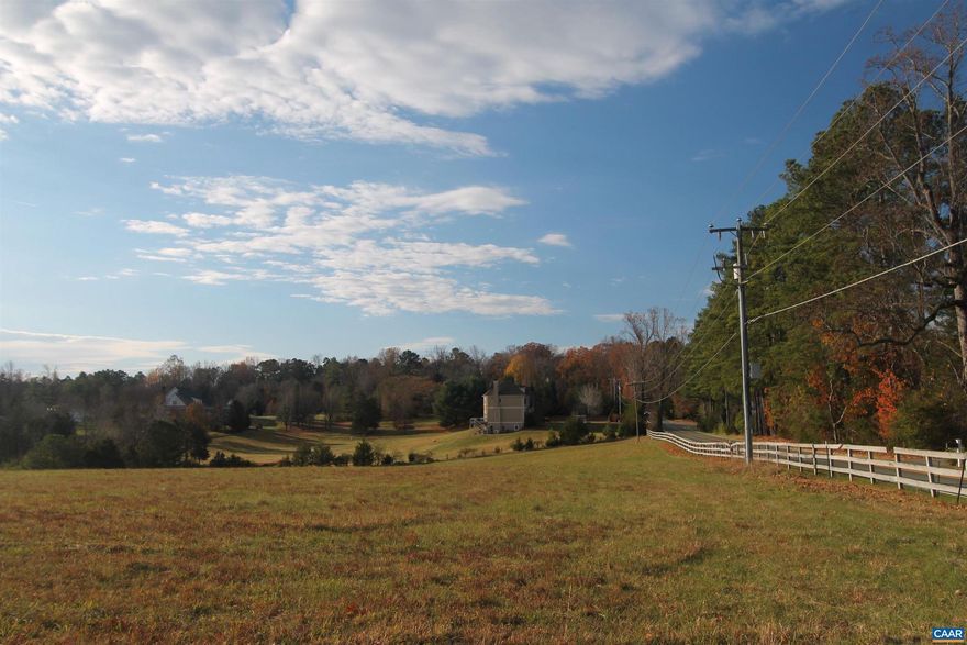 Situated in the highly sought-after Ivy area and just under a mile from Ivy Elementary School, this six-acre parcel features gently rolling, mostly open pastureland, an intermittent spring/creek, and potential for division. With frontage on Owensville Road, it offers an exceptional opportunity for a homesite.