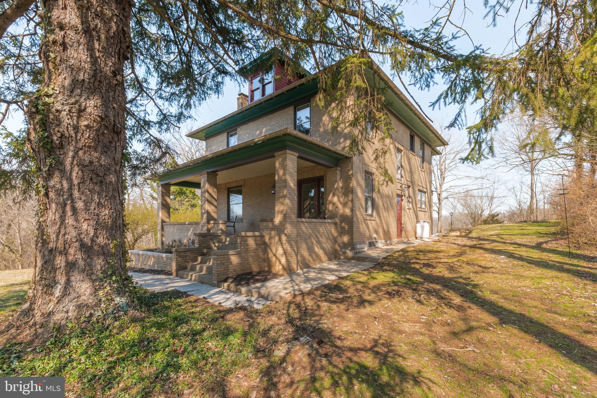 A once in a lifetime opportunity awaits! Own one of the very few downtown Shepherdstown homes that are blessed with panoramic views of the bordering Potomac River. This beautiful 1920's Art Deco home is a striking example of the prosperity of the day with its welcoming foyer and grand staircase adorning the front entrance. Set peacefully alongside the neighboring James Rumsey Monument Park, the 5 bedroom home features 9 foot ceilings, handcrafted trim work and built-ins, and traditional hardwood flooring throughout. The all-brick home features a traditional layout that is accentuated by large rooms and natural finishes. The main floor is highlighted by the adjoined family and dining room leading to a sunroom that transitions the indoor and outdoor seamlessly. The walk-out patio is an ideal location for backyard barbeque and a few steps further will reveal stunning views of the Potomac River Valley. The second floor consists of 4 bedrooms that share a full bathroom. The largest of the bedrooms has private access to the sleeping porch that overlooks the backyard and holds its own breathtaking views of the mountains. There is also access to a floored attic which is great for storage, and could possibly be upgraded to finished living space. The basement is setup as an in-law suite and comes ready with a 5th bedroom, a full bathroom, and a kitchenette - creating a very nice efficiency with its own exterior entrance. Don't let yourself miss this opportunity; it may never come again!