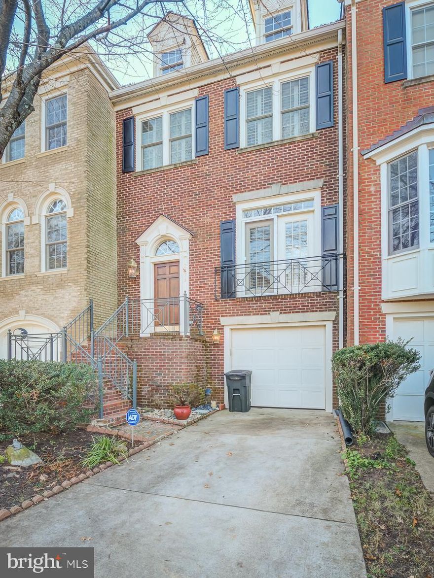 Beautiful All Brick Stanley Martin Townhome in a Superb Location.   From the moment you enter through the  classic front door you will witness the quality features throughout.   Features include:  A marble foyer,  artistic columns,  gleaming hardwoods on multiple levels,  plantation shutters, two fireplaces,  spacious rooms, high ceilings, french doors, a luxury bath and a gourmet kitchen.  The kitchen is highlighted by a beautiful countertop, elegant cabinets,  stainless steel appliances, new flooring and oversized windows.  From the kitchen you can walk out to the recently redone expansive deck which faces privacy.  The lower level is fully finished with a full bath, a brick fireplace, built in bookshelves, large windows and  walks out to another deck in a backyard which is fully fenced and private.    The upper level currently has two huge Master bedrooms which can easily be converted back to three bedrooms.   In addition this home boasts a cedar shake roof which was done just 4 years ago.   Parking consists of a garage, driveway and open spaces in the development.  This location can not be beat as you are situated between Tysons Corner and The  Mosaic area;  So you are minutes from I-495, I66, Two metros,  the W&OD trail and all the excellent schools Vienna has to offer.  Don't Miss it!  Open House this Sunday 1-4.