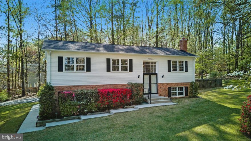 Extremely rare Single-Family Home on a private 1.24-acre lot in the heart of Lake Ridge! Enjoy your own peaceful retreat while being just minutes from shopping, dining, golf courses, Chinn Aquatic Center, Chinn Park Library and Lake Ridge Park and Marina. This spacious split foyer features 3 bedrooms, 3 full bathrooms, and 2 finished levels with multiple updates throughout. Main level offers a large Living Room, Dining Room Area, and Sun Room that opens to the Rear Deck—perfect for entertaining. Eat-In Kitchen includes Stainless Steel Appliances, Granite Counters, Pantry and ample Table Space.  Primary Bedroom includes multiple closets (one with attic access) and an Attached Primary Full Bathroom with separate vanity and shower area. Two additional Guest Bedrooms and Full Hall Bathroom with Shower/Tub Combo complete the Upper Level.    Lower Level features a Spacious Family Room with Brick Wood-Burning Fireplace, an Office/Den, Full Hall Bathroom, and a Utility Room with Washer/Dryer Hook Ups. Access to Attached Garage from Lower Level hallway.  This property has a 1-Car Attached Garage and a 1-Car Detached Garage—both with openers and electric. Ample paved driveway offers additional parking. Freshly painted throughout. Mature landscaping with scenic views. A one-of-a-kind opportunity in an unbeatable location!