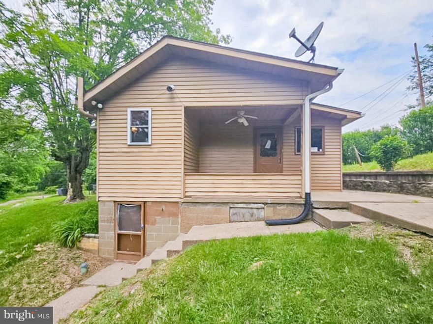 Make this charming 2-bedroom, 1-bath cottage your own! Nestled on a generous 0.236-acre lot in Fayette City, this quaint home exudes warmth and character. Step inside to find a bright and inviting living room filled with natural light. With approximately 864 square feet of living space, there’s plenty of room for your personal touch. The kitchen boasts ample cabinetry and flows seamlessly into a dining area. The back door opens to a lovely porch, where you can relax and soak up the fresh air and sunshine while admiring your spacious, wooded yard—a perfect canvas for your garden dreams or outdoor gatherings. This home is a diamond in the rough, eagerly awaiting your creative vision and tender loving care. Don’t miss this incredible opportunity—the potential is limitless! Schedule your showing today and take the first step toward making this house your dream home! Being Sold AS IS, WHERE IS. Buyer is responsible for all inspections & city requirements for closing. All info, including utilities & room dimensions, is approximate, deemed reliable but not guaranteed, & should be independently verified. The seller does not guarantee that all property details are included.