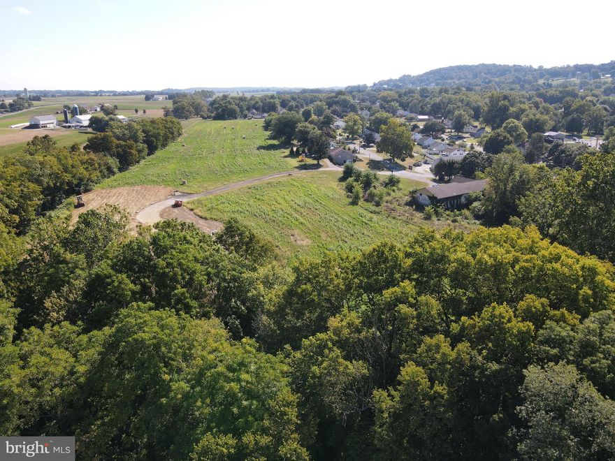This property will be offered at Public Auction on THURSDAY, NOVEMBER 6, 2025 @ 4PM (note 4pm start time).  The listing price is the opening bid only and in no way reflects the final sale price.  10% down due at auction, 2% transfer tax to be paid by the purchaser, real estate taxes prorated. These two parcels in West Hempfield Township present a rare opportunity, combining privacy, scenic views, and versatile potential. Together offering 20 acres—Parcel 1 with 12.5 acres and Parcel 2 with 7.5 acres—the land is perched on a high ridge overlooking a creek and sweeping Lancaster County farmland. Parcel 1 includes a barn in as-found condition that may provide valuable stormwater credit, along with low ground with a creek, creating a peaceful environment. Parcel 2, at 7.5 acres, offers additional tillable acreage and elevated views. The properties sit at the edge of a residential neighborhood yet feel secluded, with agricultural land and steep terrain behind them ensuring lasting privacy. Both parcels are enrolled in Clean & Green but are not preserved, and public water & sewer are available. Zoned R2 Residential, the property provides flexibility for future use—whether you envision a dream homestead or estate, continue farming its tillable acreage, or explore investment opportunities for residential development.