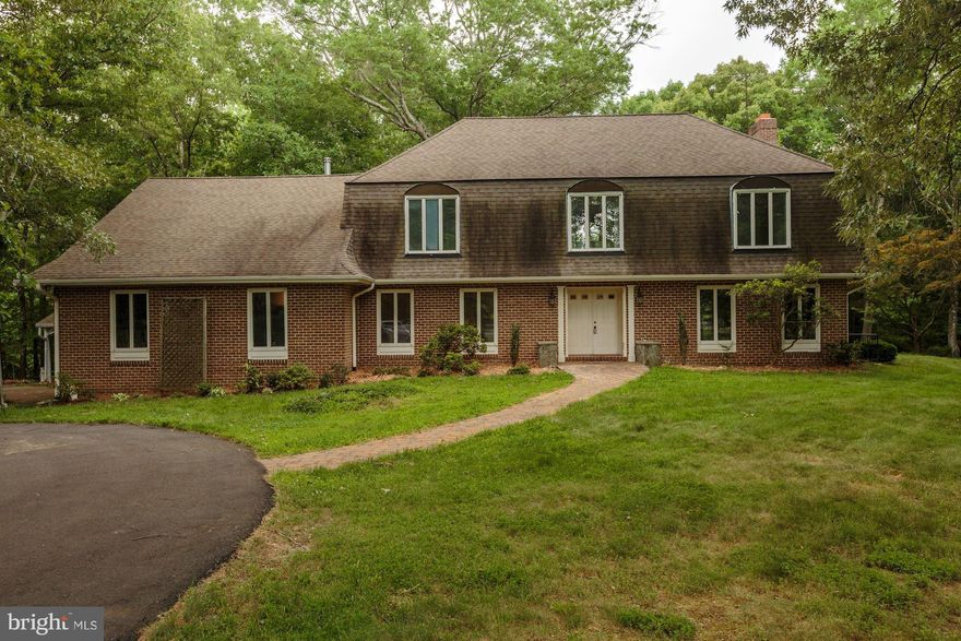 Welcome to this lovely estate sitting on 6+ acres in a bridal trail equestrian community.  This house is surrounded by the best nature has to offer sitting quietly in a cuddle-sack which provides an ideal setting for many buyers.  This is a great community that is about a 10 minute walk to Burke Lake Park.  Large massive bonus studio above garage with half bathroom and wood burning stove.