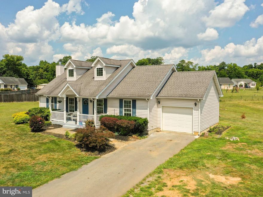 Are you looking to be close to town and conveniences, but want a larger lot with NO HOA restrictions?  If so, this is the perfect home for you!  As you approach the front door, the lovely brick walkway leads up to a porch just waiting for you to pull up a rocker with a cold glass of tea and enjoy the serenity of this beautiful community.  The well laid out floor plan makes this home feel spacious and welcoming.  Very livable with two secondary bedrooms and a hall bathroom and a large primary bedroom boasting a walk-in closet and an en suite with dual sinks.  The kitchen will be a delight to prepare meals in with its updated, stainless-steel appliances and attractive finishes with access to the full unfinished basement that is awaiting your vision to make it what you want with a rough-in for a third bathroom and fireplace insert with blower already installed and walk-out to the back yard.  Out back is a patio and fire pit, as well as play equipment for the kids.  This is a house you will be delighted to call home.