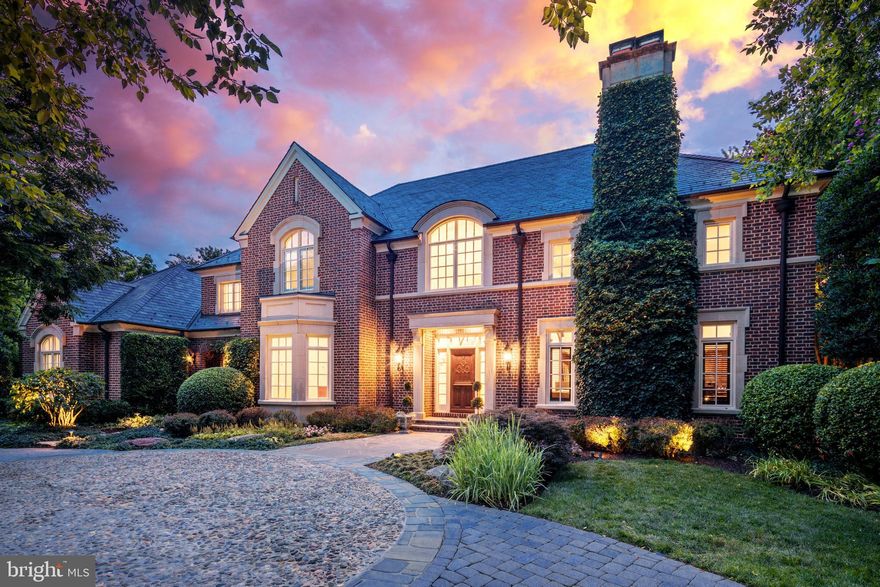 The latest house to hit the market in Woodlea Mill, McLean’s quintessential luxury neighborhood, is a striking blend of old & new - perfect for discerning buyers who appreciate rich historical details in a fresh modern setting.   The exterior pays homage to the English country manor with its genuine slate roof & handmade brick set in a Flemish bond pattern.  The hand carved Gothic mahogany front door promises more delights within.  The two-story foyer graciously welcomes your guests with honed marble floors & expansive views to the family room & large back yard.  To the right is the great room whose vaulted ceiling soars above a massive old fireplace from France & rich paneling with carved quatrefoils rescued from a 19th century church in England.  A wet bar with refrigerator enhances the club-like atmosphere; challenge guests to find the secret hidden closet in the paneling!  Other English features abound in the spacious kitchen, breakfast & family rooms. The kitchen cabinetry was crafted in England of rare English oak, with wrought iron accents forged in the local village & storage baskets woven there as well. The countertops are Jerusalem limestone in a leathered finish that highlights the abundant fossils. Top of the line appliances are hidden behind custom panels.  An elegant butlers pantry with a second dishwasher and warming drawer leads into the airy dining room with a bow window & gas fireplace.  Across the foyer from the great room, the dining room features the same modern chandelier & wall sconces.   The large family room has wooden beams in the 10’ ceilings to complement a deep mantle set into the stone fireplace. Custom cabinetry flanks the fireplace, hiding the TV and storing games, blankets & other essentials.  A wall of windows looks out onto the water feature’s charming bronze sculpture & the relaxing sound of a waterfall flowing into the pond can be heard when the windows are open.  A traditional glass conservatory just off the family room also brings the outdoors in.  Built by Tanglewood Conservatories, it has its own heating & cooling system & an antique trough faucet for easy watering of the plants & trees that thrive within.  French doors from the breakfast room, family room & conservatory all lead to a meandering flagstone patio & deep back yard, designed by Charles Owen of Fine Landscapes.  The yard is anchored by a dining pavilion with oversized fireplace & outdoor kitchen with built-in grill  & refrigerator.  A decorative metal gate leads up the stone steps to a large pool with deck jets & a separate spa with waterfall, all controlled by you with an app on your phone.  A pergola covered with wisteria offers a quiet retreat at the deep end of the pool. A large integrated storage shed is nearby with a programmable irrigation control box.  The second level features a huge owners suite with gas fireplace, limestone luxury bath with therapeutic spa, & separate closets with built in dressers & shelves. A clever pass-through door from the closet into the laundry room makes that job less of a chore.
Three more en suite bedrooms with large closets & built-in shelves complete the upper level & share a rear staircase to the family entrance. While usually not a notable feature in a home, a large storage closet holds another secret: a TV mounted in it plays TV shows on the bathroom vanity through a one-way mirror! The lower level also has a surprise in store for you: a Sport Court!  It’s perfect for practicing golf, lacrosse, tennis or just playing around.  The pads are removable on the far wall to allow “bounce back” practice.  There’s also a separate gym with a mirrored wall, ceiling fans, and a TV. A large recreation room features a fifth fireplace & an expanse of built-in shelves.  The two guest bedrooms in the lower level share a full bath & have ample closet space. Completing this level is a temperature controlled wine cellar for 900 bottles.