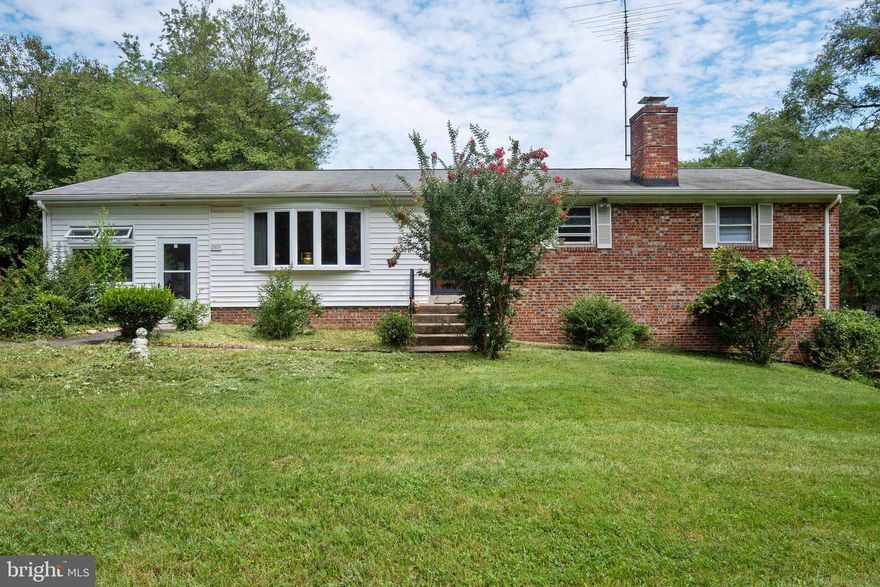 WELCOME HOME! 3 Bedroom + 2 Full Baths and 1 Half Bath. Sits on ONE ACRE of land. This well-maintained rambler home is ready for its next homeowner! ** New water heater and New sump pumps. New smoke detectors on each level. Hall smoke detectors with carbon monoxide detector. *** Original hardwood floors throughout and  a master bedroom with its own master bath. ** Beautiful tile flooring throughout the huge walk-out basement, along with a half bath and a game room that comes with a vintage pool table. **Come and enjoy the fireplace on the lower basement level with built-in seating and plenty of space for your friends and family to gather for a game or movie night. *** Not to mention the  beautiful enclosed side porch is perfect for a cozy spot to read a book or have a get-together.  **A must-see! Schedule a tour today!**  Offers due by Monday, August 24th, at 7PM.