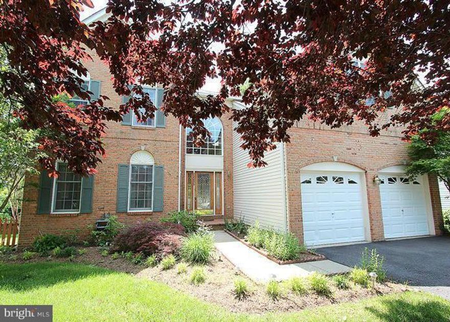 Magnificent Brick Colonial situated in a private lot Cul-De-Sac back to beautiful mature trees. Huge 1200 sqft+ custom composite deck w/ remote retractable awning. Gleaming hardwood on main & upper level. Two-story foyer, formal living & dining room. Open large kitchen w/ granite & tiles floor. Family room w/ stone Fireplace. Fully finished walk-out basement, stone wet bar & 2nd stone fireplace.