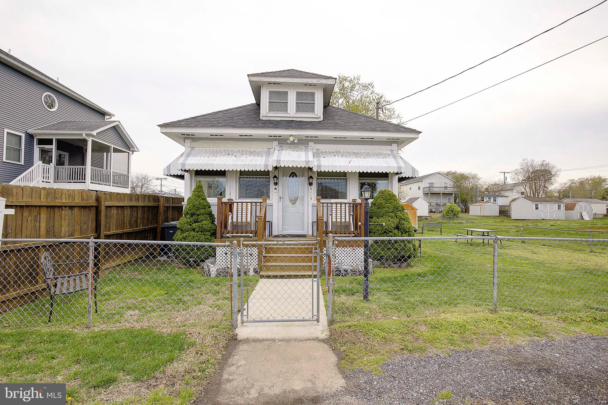 Calling all Investors or DIY buyers!!! Price reduced to reflect some repairs needed in crawlspace, flooring etc. Sold as-is. Price just reduced $30,000 to reflect repairs needed. Located in a great spot in town limits off North Beach and is on city water & sewer. This larger cottage has 1,440 sf with 3 bedrooms, 1 full bath. Just a short stroll away from the town beach and boardwalk to watch the sunrise --or grab a bite to eat at the nearby restaurants! Built in 1935, this charming home has oil heat, a roof just five years old, HVAC for central a/c is just nine years old. You'll love the sunroom with tons of windows for enjoying fresh air breezes, or just enjoy sitting out on the front porch. The main level also has a living room, galley kitchen, separate dining room, and a laundry closet. The primary bedroom and full bath are also on the main level. Upstairs you'll find two spacious bedrooms. Rich, knotty pine wood throughout much of the home gives it a unique character and charm! The lot is fully fenced and has a spacious side yard to garden or play. In area of top rated schools with an easy commute to Washington DC, Annapolis and JB Andrews. Close to marinas, local shops, parks, water park, community center and senior center. Walkable to the monthly First Fridays at the boardwalk and Farmer's Market every Saturday throughout the season! Please note restricted hours for showings (noon-6 pm only daily and no Saturday showings)